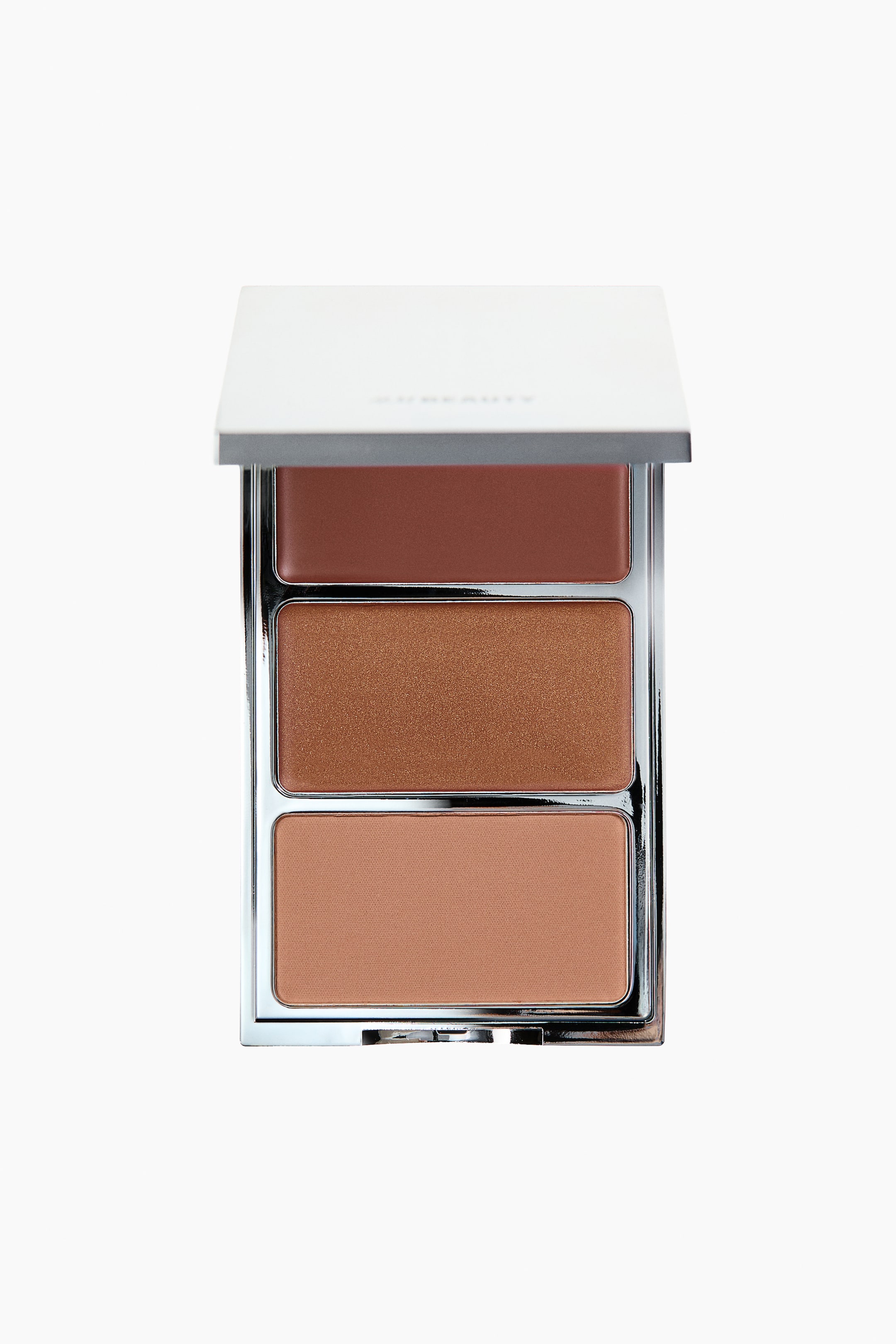 View larger image: A bronzer trio palette is displayed front-facing, with its white lid open, revealing three rectangular pans. The pans showcase a dark reddish-brown cream bronzer at the top, a shimmery medium-brown powder bronzer in the middle, and a matte light-brown powder bronzer at the bottom.