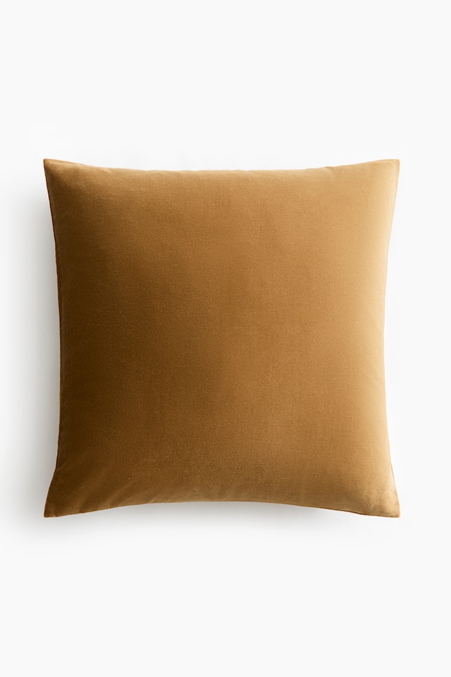 A square, warm brown cotton velvet cushion cover is visible from the front, displaying a soft, plush texture. - 1