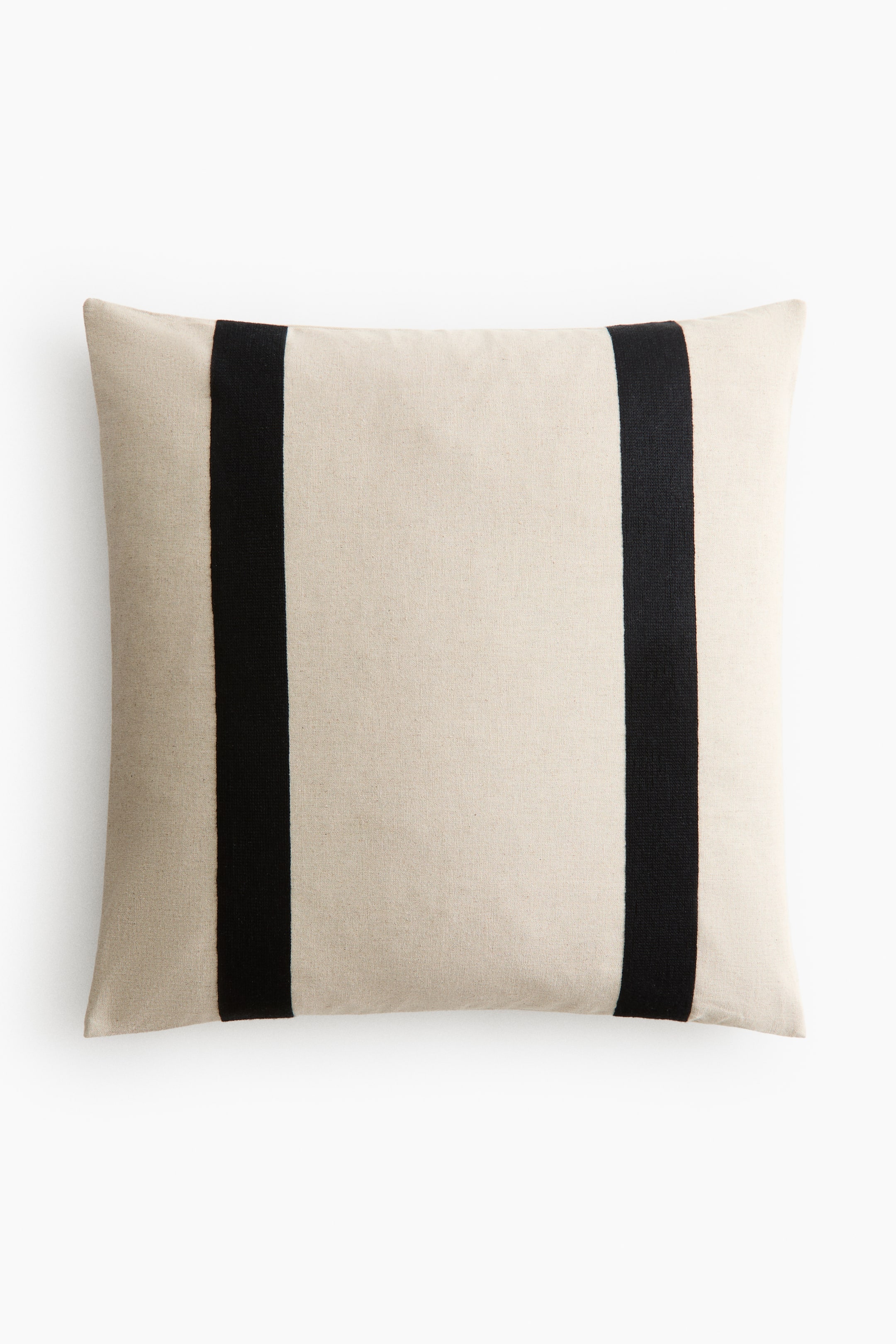 View larger image: The cushion cover, rectangular in shape, showcases its front with a light, neutral-hued fabric featuring a rustic weave. Two broad, vertical black stripes are elegantly embroidered on the cover.