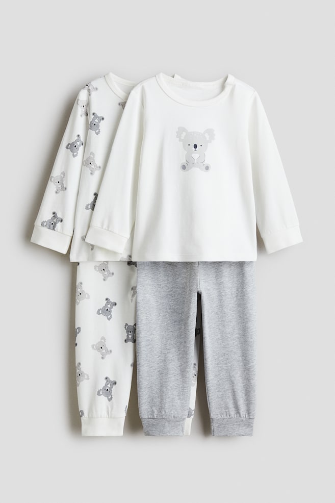 2-pack printed cotton pyjamas - White/Koalas/Light pink/Bunnies/White/Dinosaurs/Light beige/Animals - 1