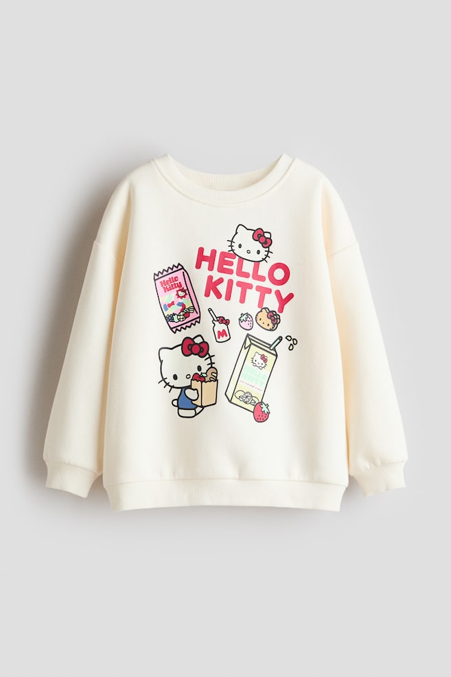 Printed Sweatshirt - Cream/Hello Kitty/Light beige/Lilo & Stitch/White/Hello Kitty/Light blue/Hello Kitty/Cream/Hello Kitty/Cream/Bluey/Light blue/Cinnamoroll/White/Peppa Pig/Pink/Hello Kitty/Light purple/Hello Kitty/Gray melange/Lilo & Stitch/White/Minnie Mouse/Light purple/pink/Turquoise/Gabby's Dollhouse - 1
