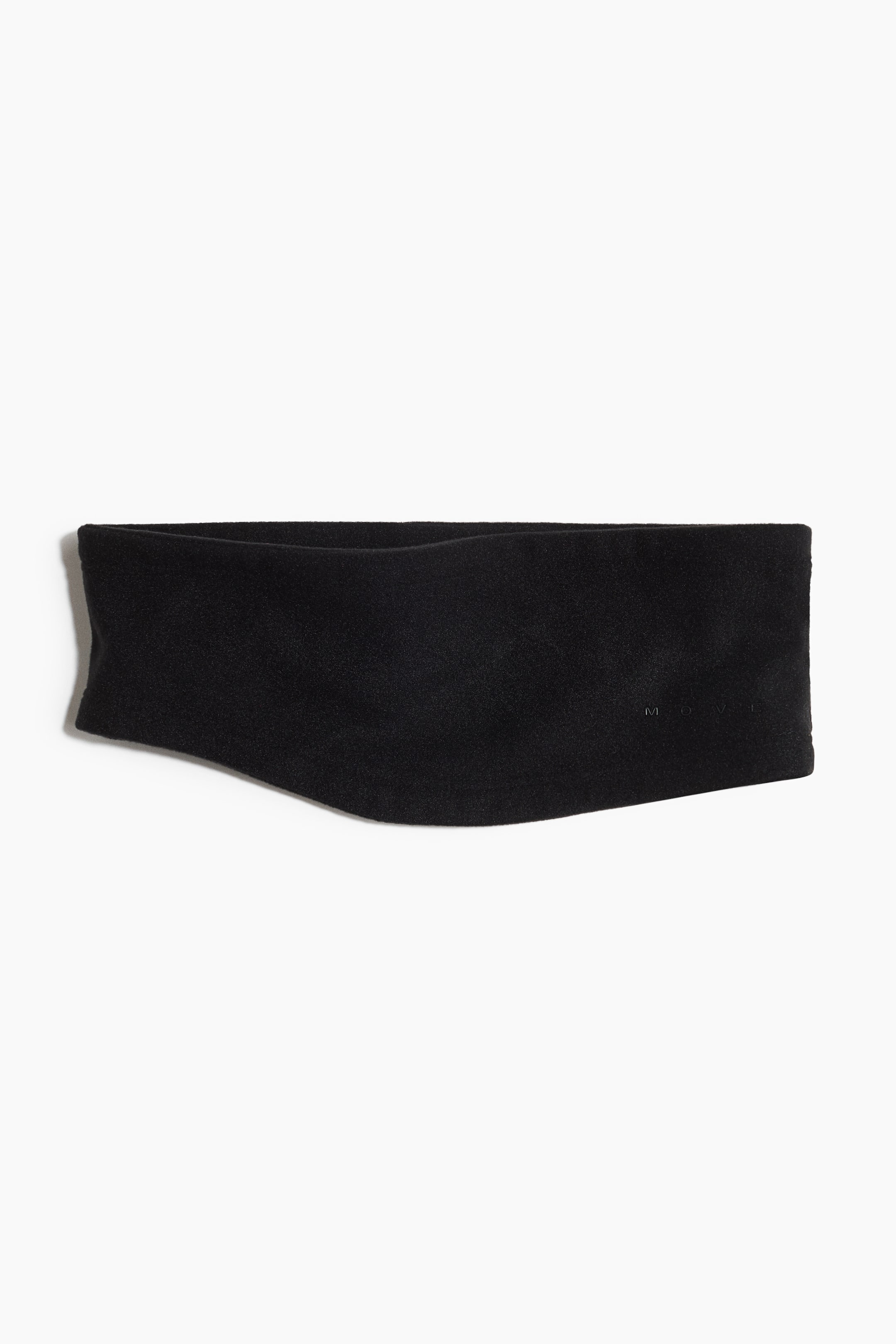 View larger image: A black fleece headband is lying flat, showcasing its soft texture and a subtle ergonomic curve. The word 'MOVI' is subtly embossed on the right side of the headband.