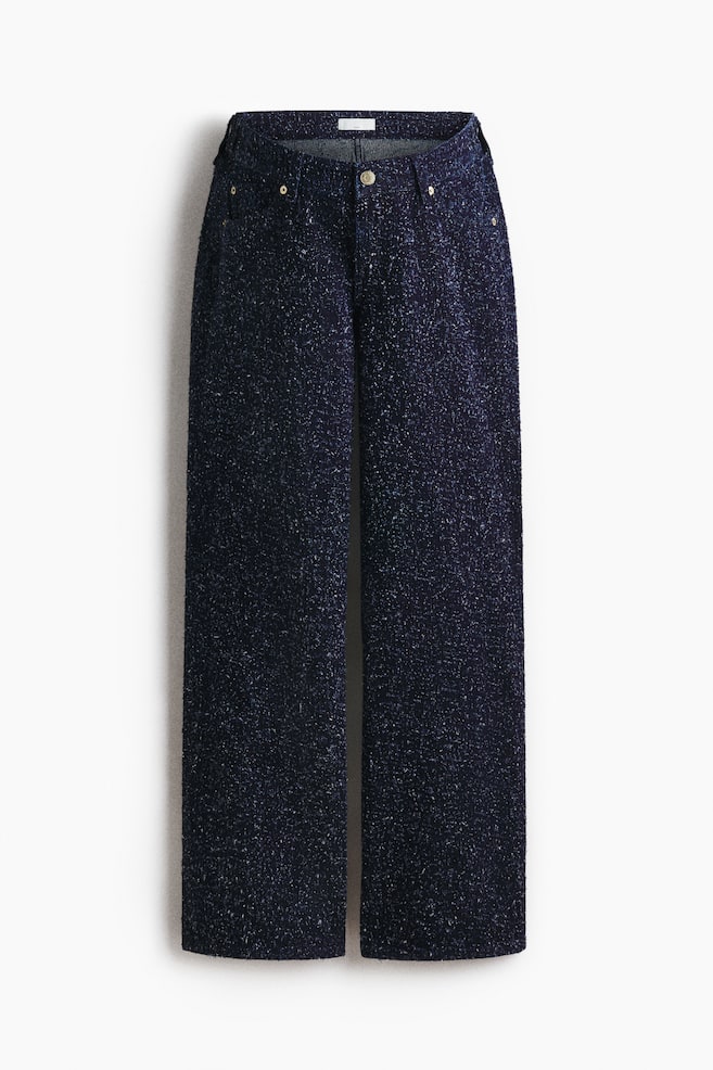 FRONT view of dark blue, wide-leg pants, featuring a speckled, textured fabric, a central button closure, and two golden rivets on the front waistband. - 1