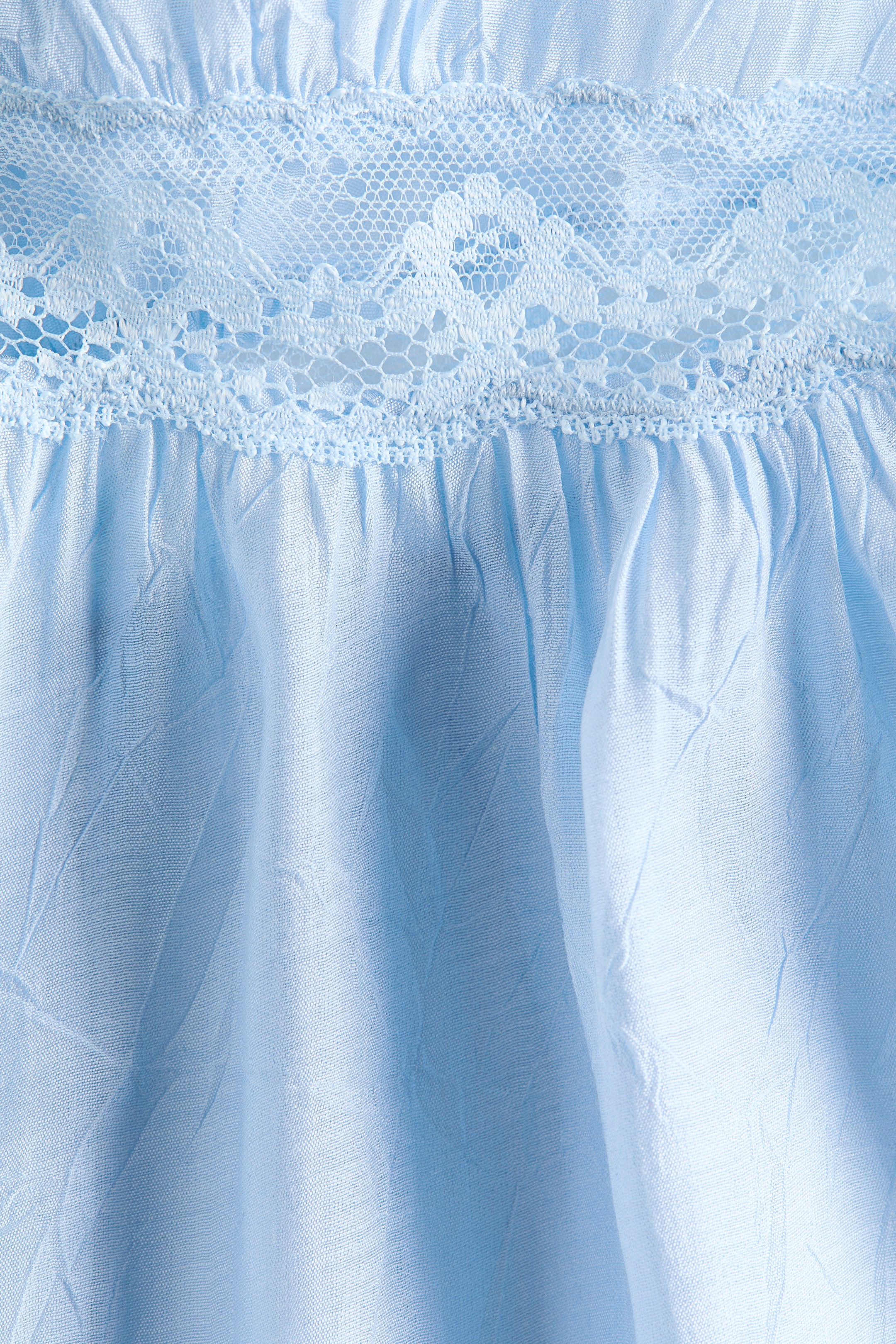 Haut péplum avec dentelle