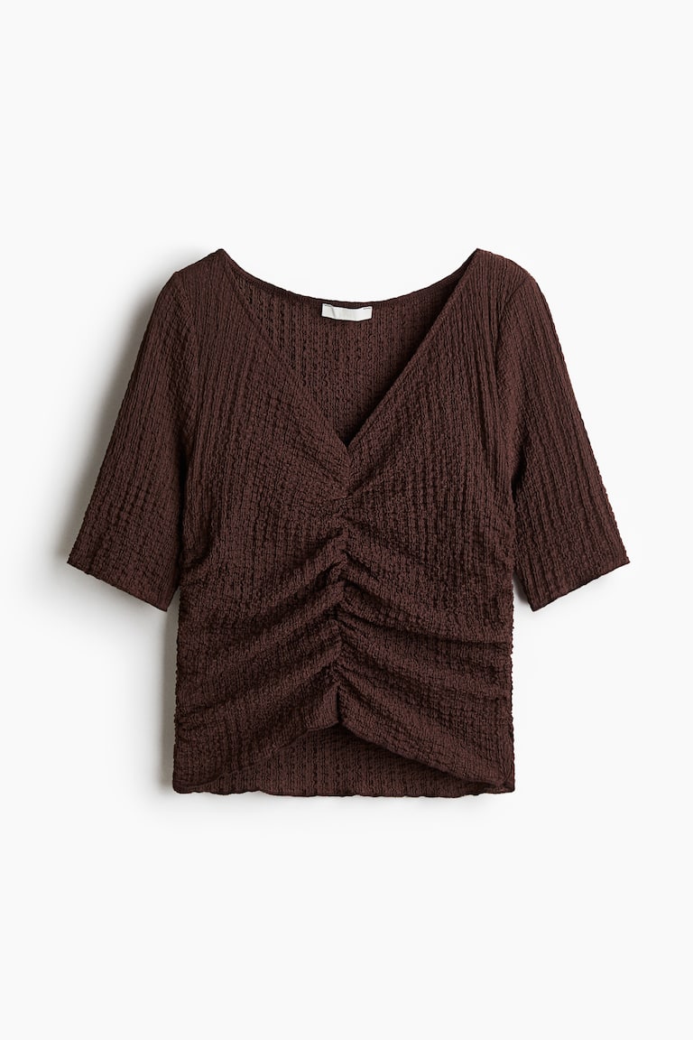 Drapirana bluza od reljefnog materijala