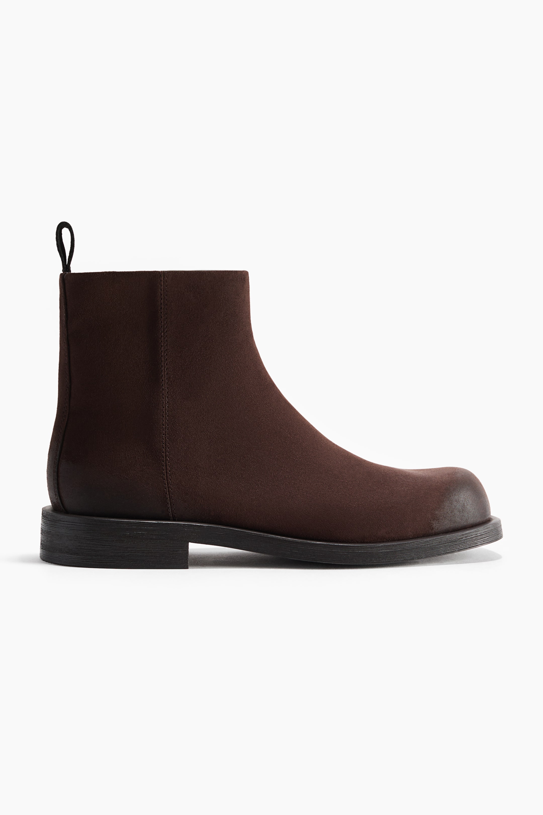 View larger image: An ankle boot in dark brown matte fabric is shown in side profile facing right, featuring a rounded toe with a burnished tip, a low block heel, and a black pull loop at the back collar.