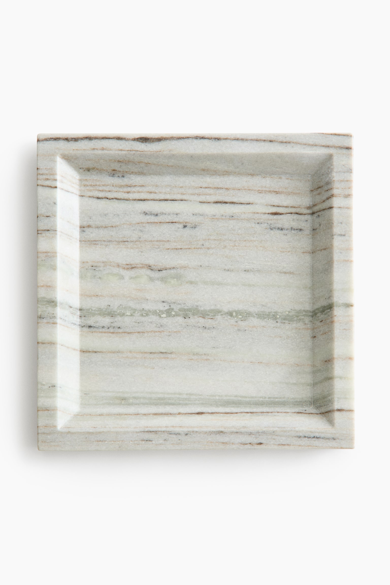 A square marble tray is shown in a top-down view, featuring a recessed centre with slanted inner edges and a flat, raised border. The light-coloured stone displays prominent horizontal veining patterns in shades of beige, brown, and faint green.