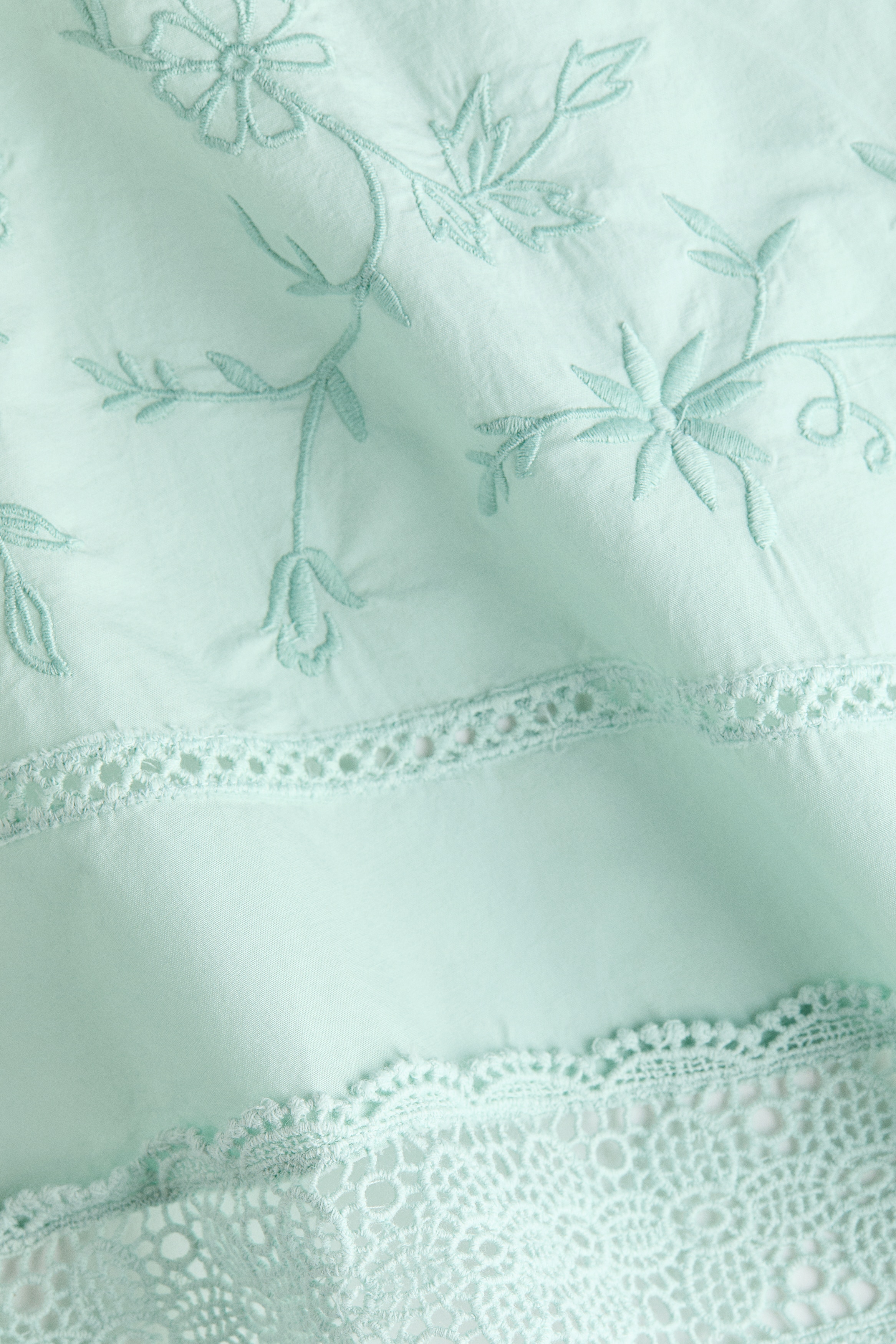 Lace-trimmed one-shoulder top