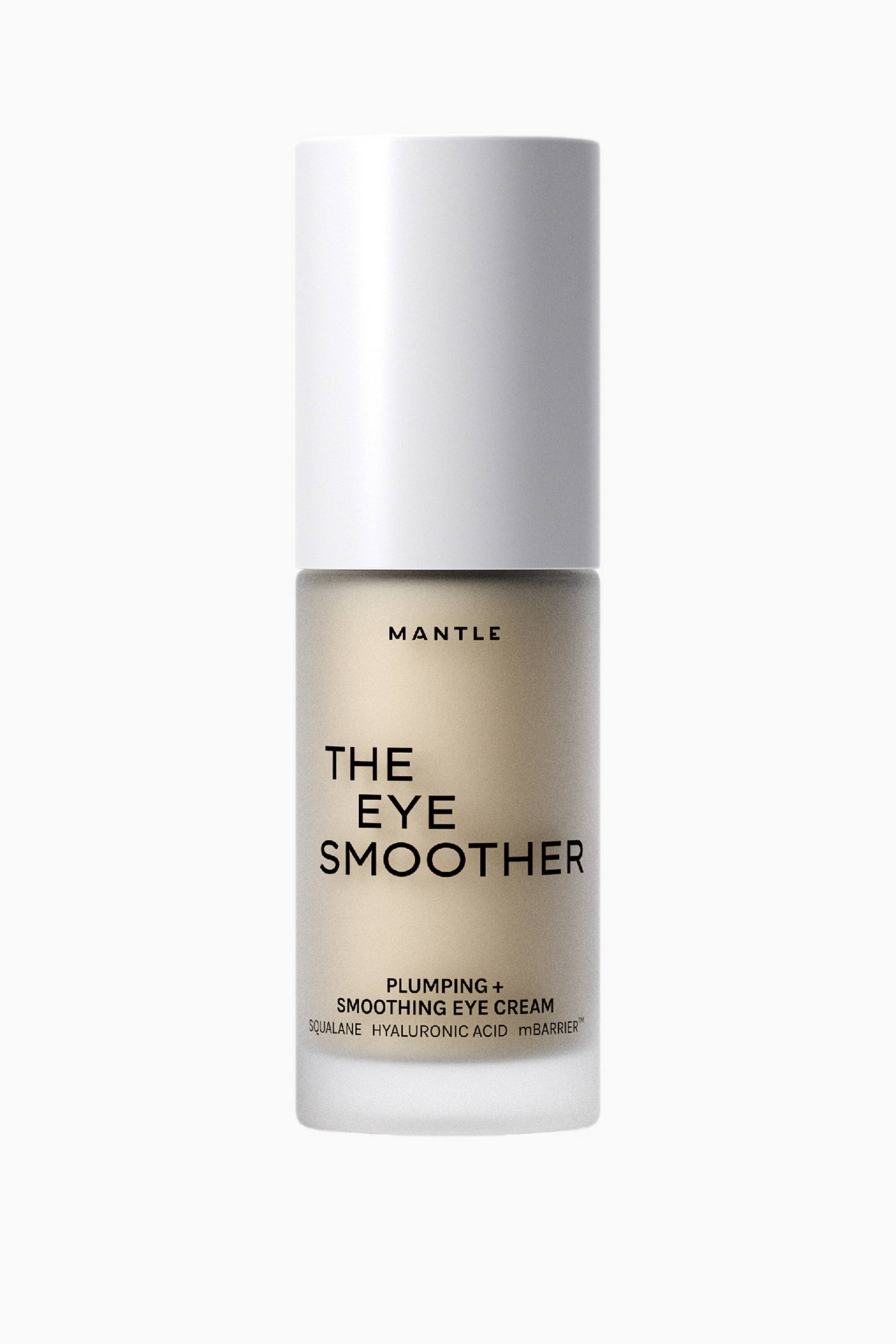 Visa större bild: En cylinderformad kosmetikflaska med en front mot betraktaren presenterar ett opakt vitt lock över en frostad glasbehållare, genom vilken en ljus beige produkt är synlig. Flaskan visar texten "MANTLE THE EYE SMOOTHER PLUMPING + SMOOTHING EYE CREAM SQUALANE HYALURONIC ACID mBARRIER?" på sin framsida.