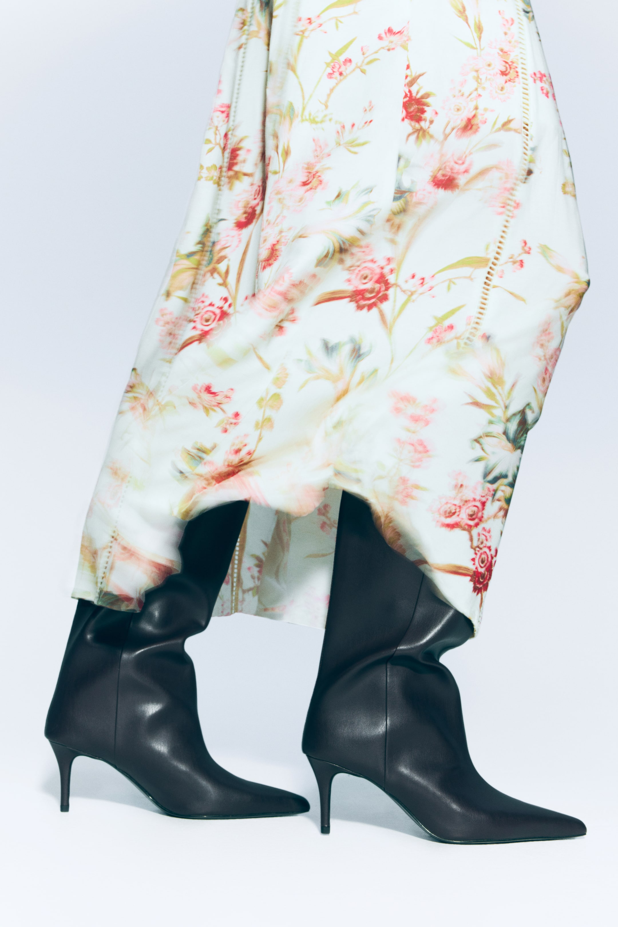 View larger image: Black boots are featuring a sleek, pointed toe and a slender stiletto heel. 