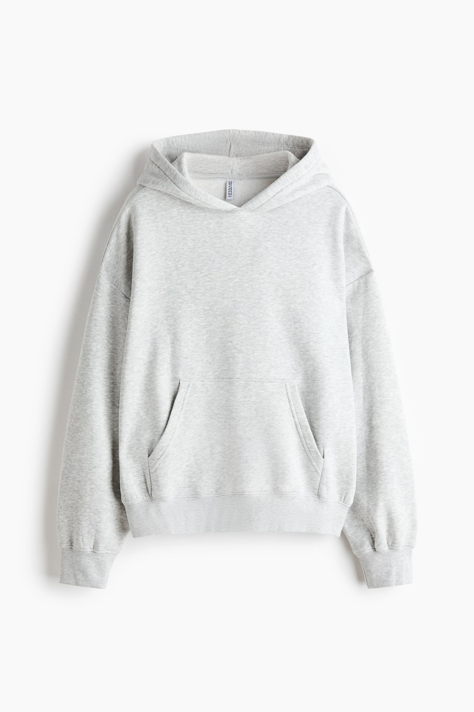 A light grey mÃ©lange hoodie is shown from the front, featuring a jersey-lined hood, dropped shoulders, and long sleeves with ribbed cuffs. The design showcases a front kangaroo pocket and a ribbed hem.