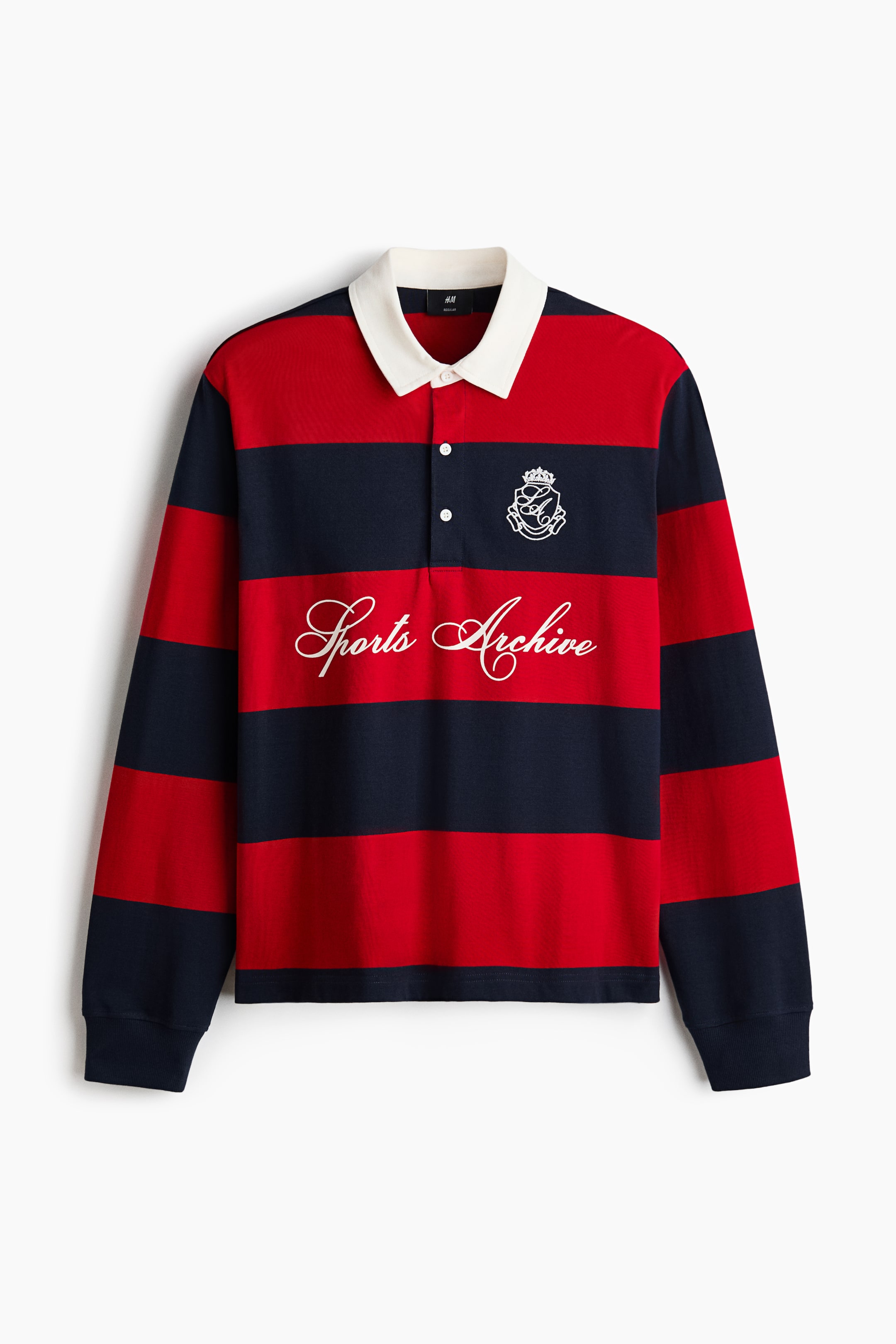 View larger image: A long-sleeved rugby shirt is shown from a front-facing angle, featuring bold red and navy horizontal stripes and a contrasting white collar. The shirt displays a two-button placket, ribbed cuffs, a straight hem, a white embroidered crest on the left chest, and white cursive script reading "Sports Archive" across the centre.