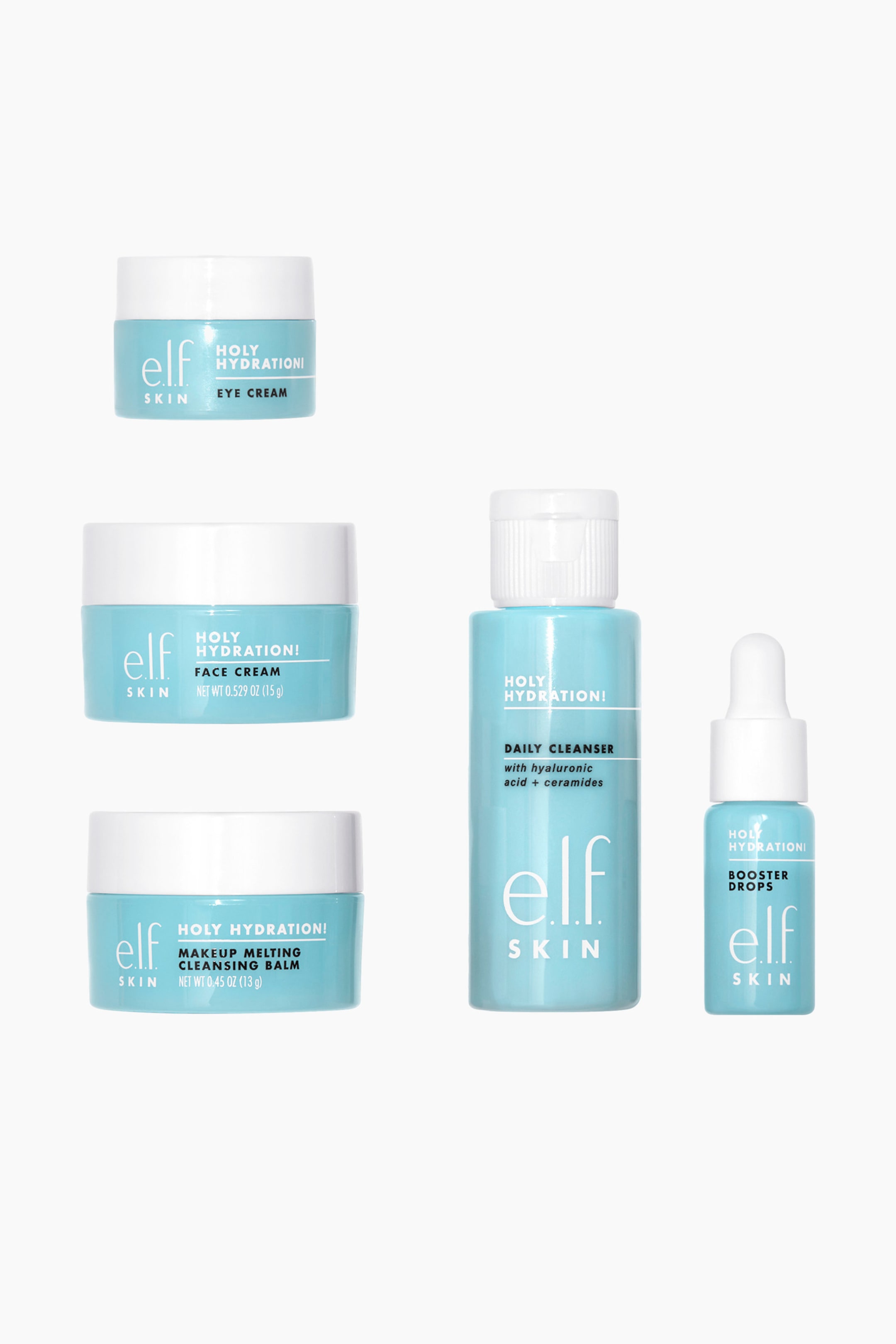 Näytä suurempi kuva: Viisi vaaleansinistä ja valkoista elf SKIN Holy Hydration! ihonhoitotuotetta on esillä, kaikki suoraan eteenpäin suunnattuina. Kolmessa purkissa on valkoiset kierrekannet ja ne on merkitty silmänympärysvoiteeksi, kasvovoiteeksi ja meikinpoistobalmiksi; puhdistusainepullo esittelee valkoisen flip-top-korkin ja on merkitty 'Daily Cleanser'; ja tehotippapullo esittelee valkoisen pipettikorkin ja on merkitty 'Booster Drops'.