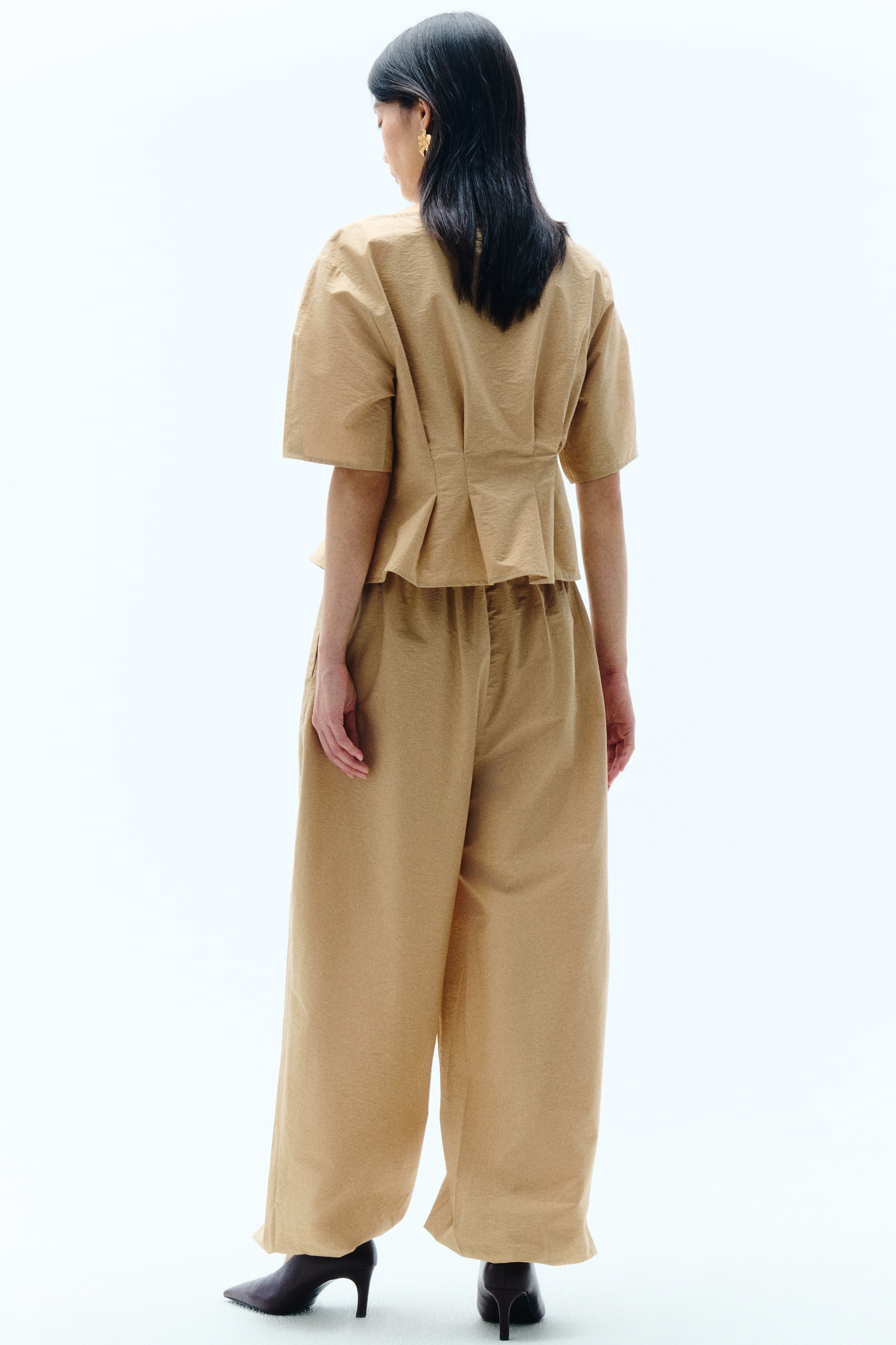 Waisted boat-neck top