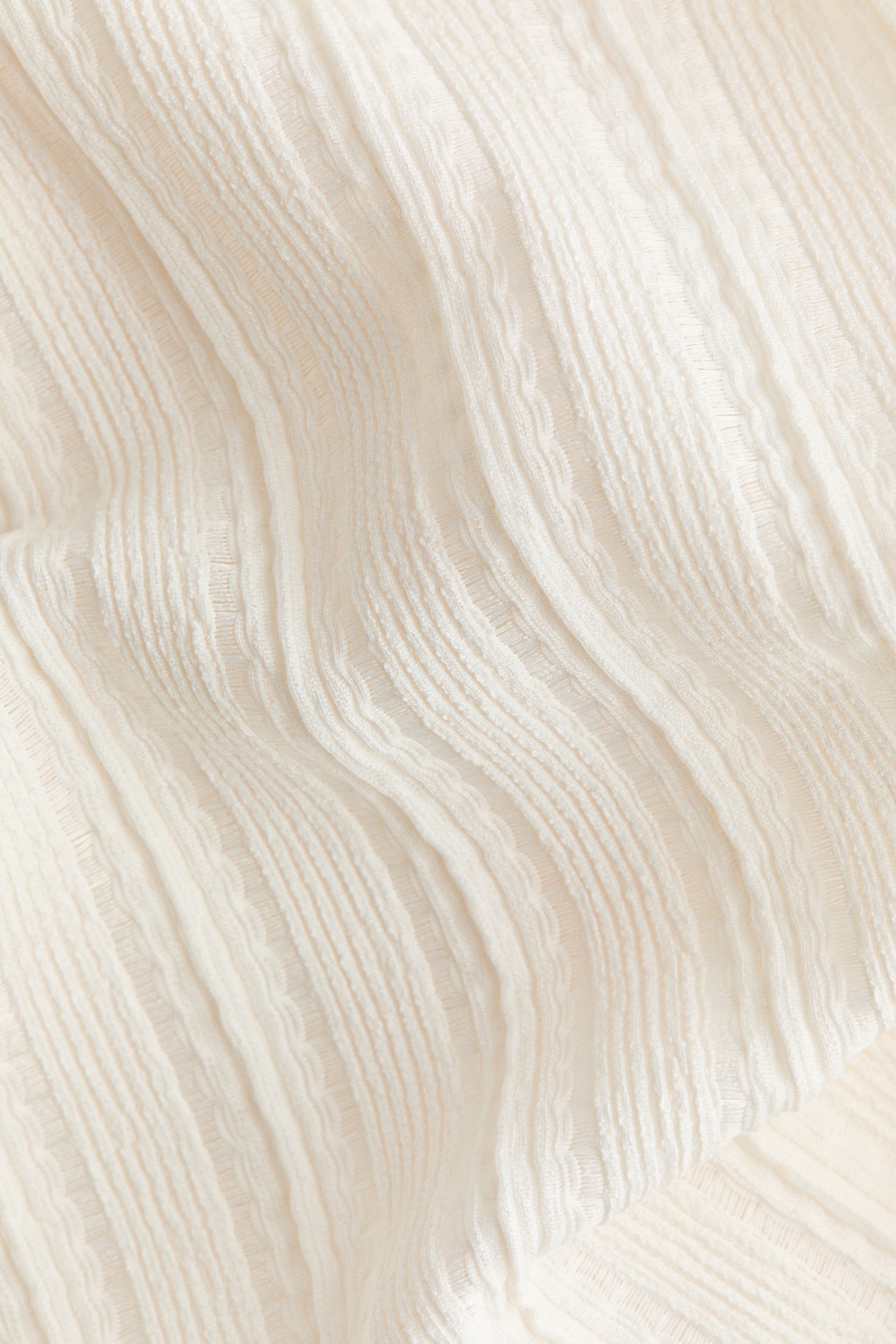Haut asymétrique texturé