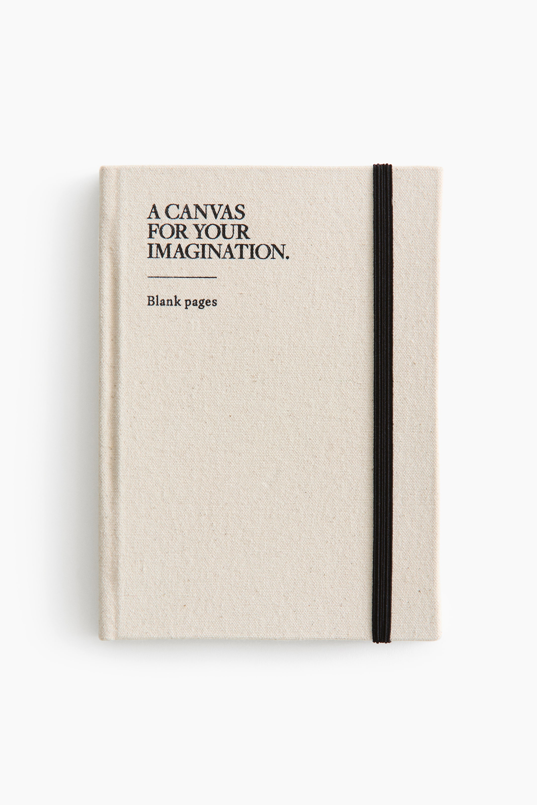 View larger image: A front-facing notebook showcases a light-colored, textured fabric cover, featuring black text that reads "A CANVAS FOR YOUR IMAGINATION," with "Blank pages" below it. A black elastic band wraps vertically around its right side.