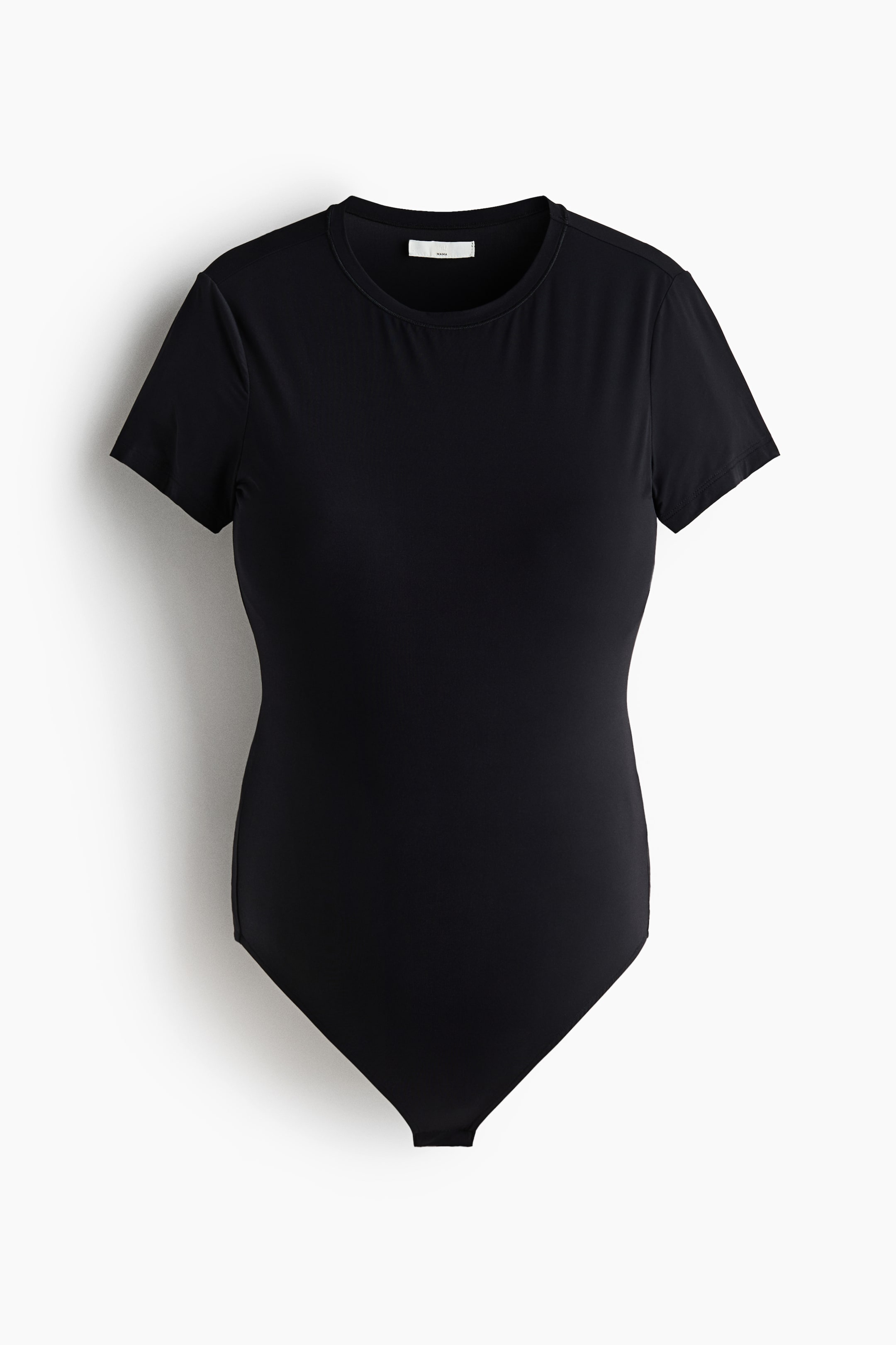 View larger image: A black bodysuit is showcased front-facing, boasting a crew neck and short sleeves. The snug-fitting garment tapers to a brief-style bottom.