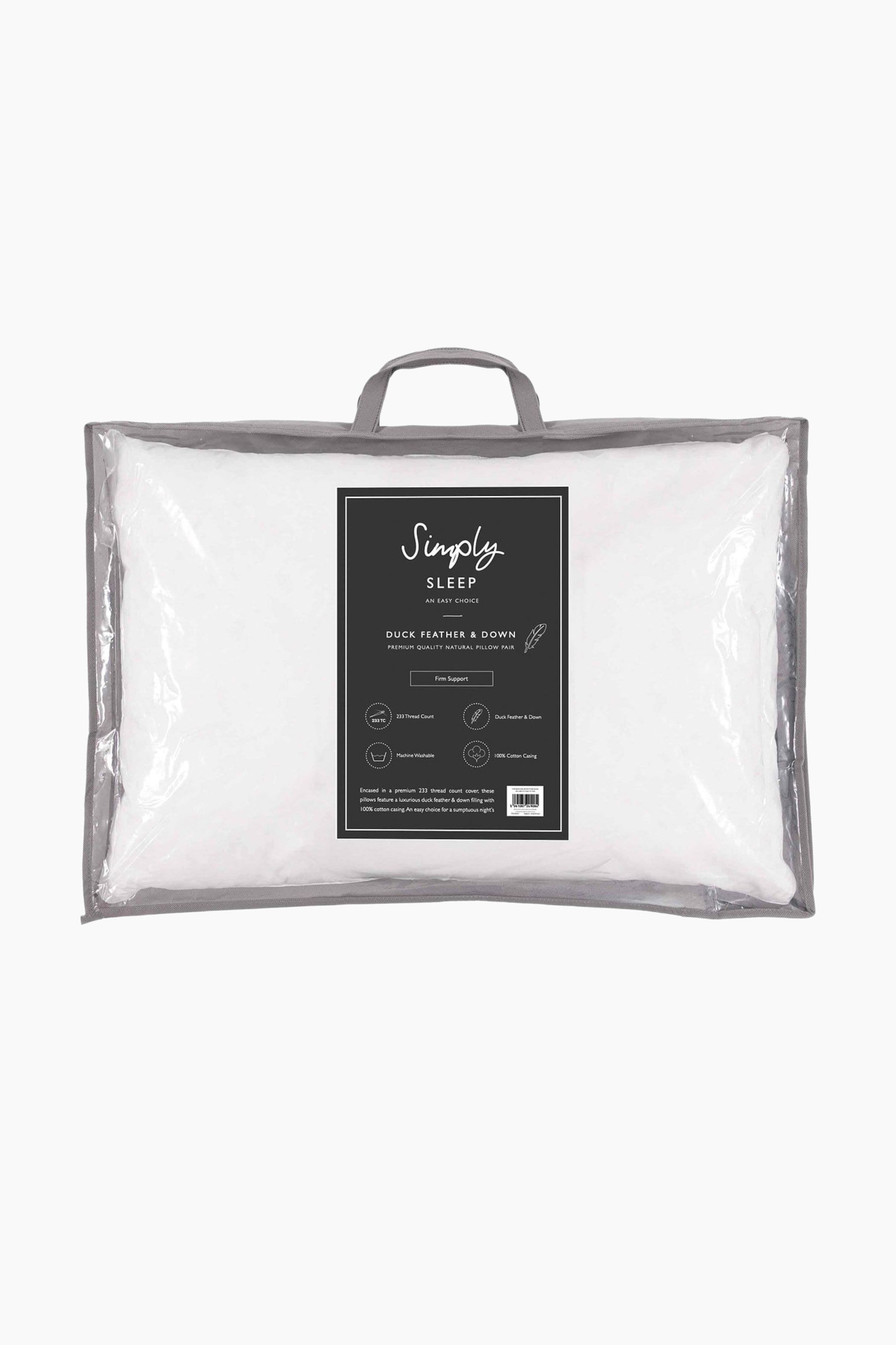 View larger image: A white pillow is showcased front-on, encased in clear plastic packaging with grey fabric trim and handles. A black and white product label, featuring text and icons, is prominently visible on the front of the packaging.