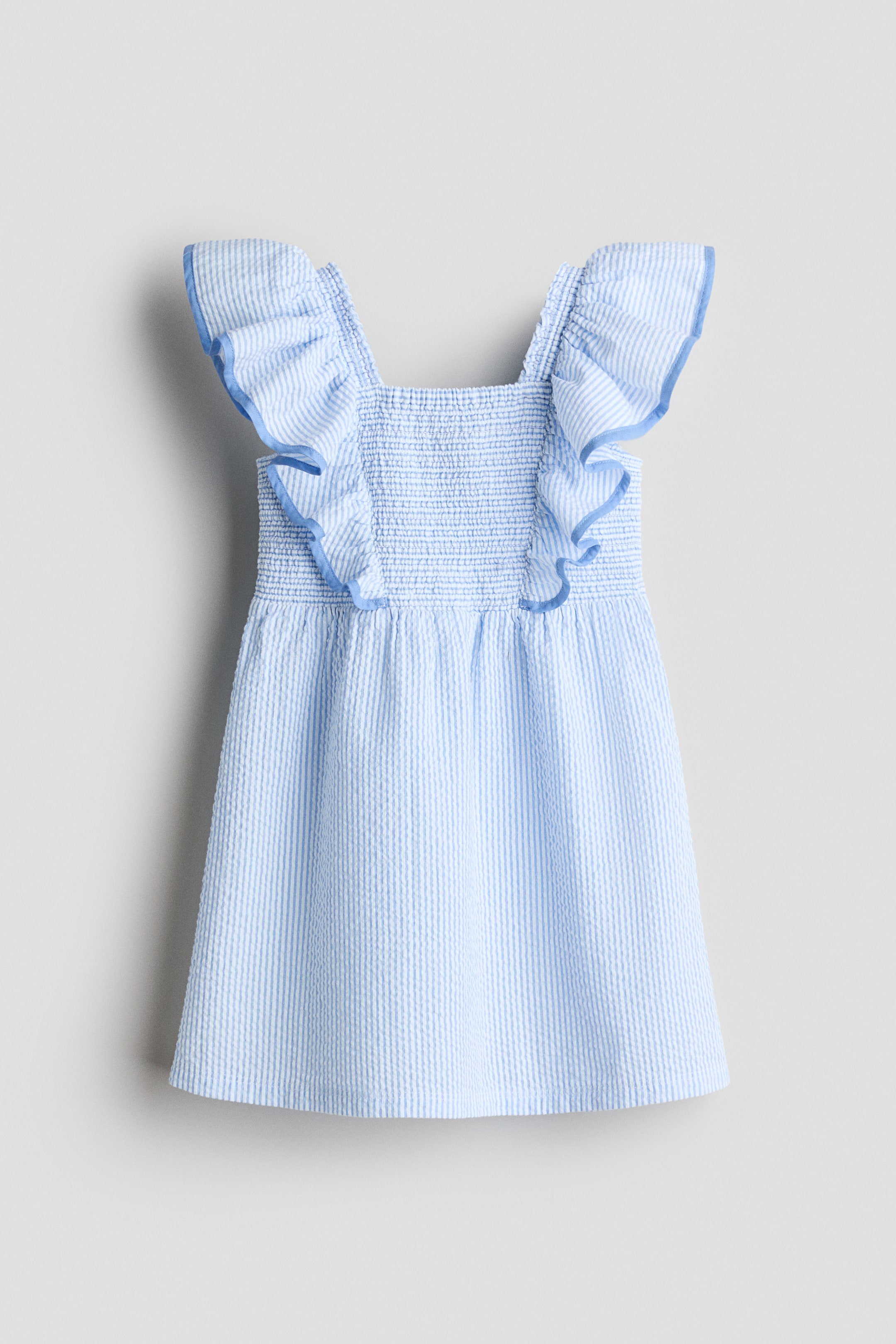 View larger image: Smocked flounce-trimmed dress - Light blue/striped - Kids | H&M US 1