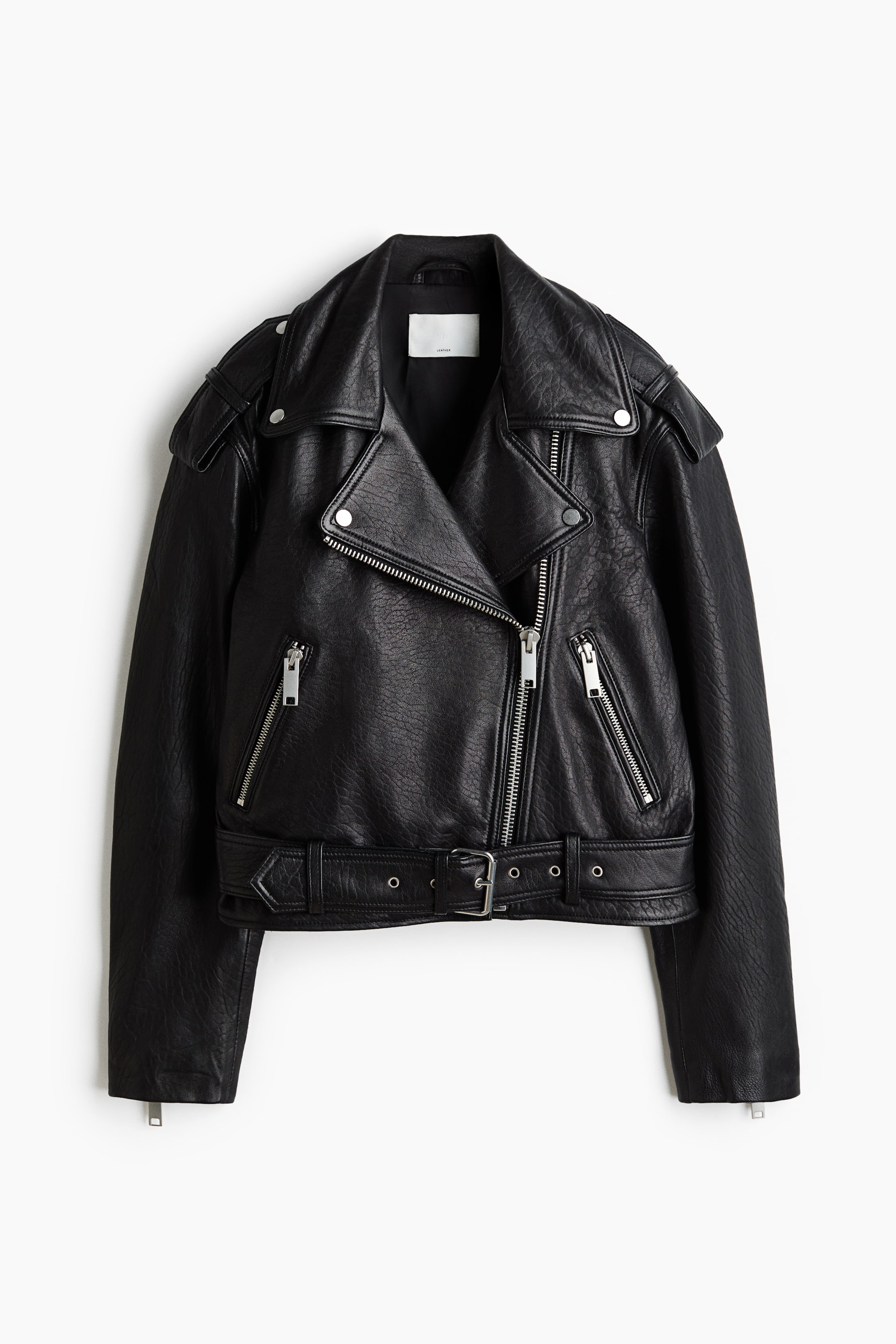 View larger image: A black leather jacket is showcasing its front, featuring wide notched lapels and an asymmetrical silver-toned zipper closure. It is highlighting shoulder epaulets with snap buttons, two zippered front pockets, one flap pocket with a snap, an adjustable belt at the waist with a silver buckle and eyelets, and zippered cuffs.