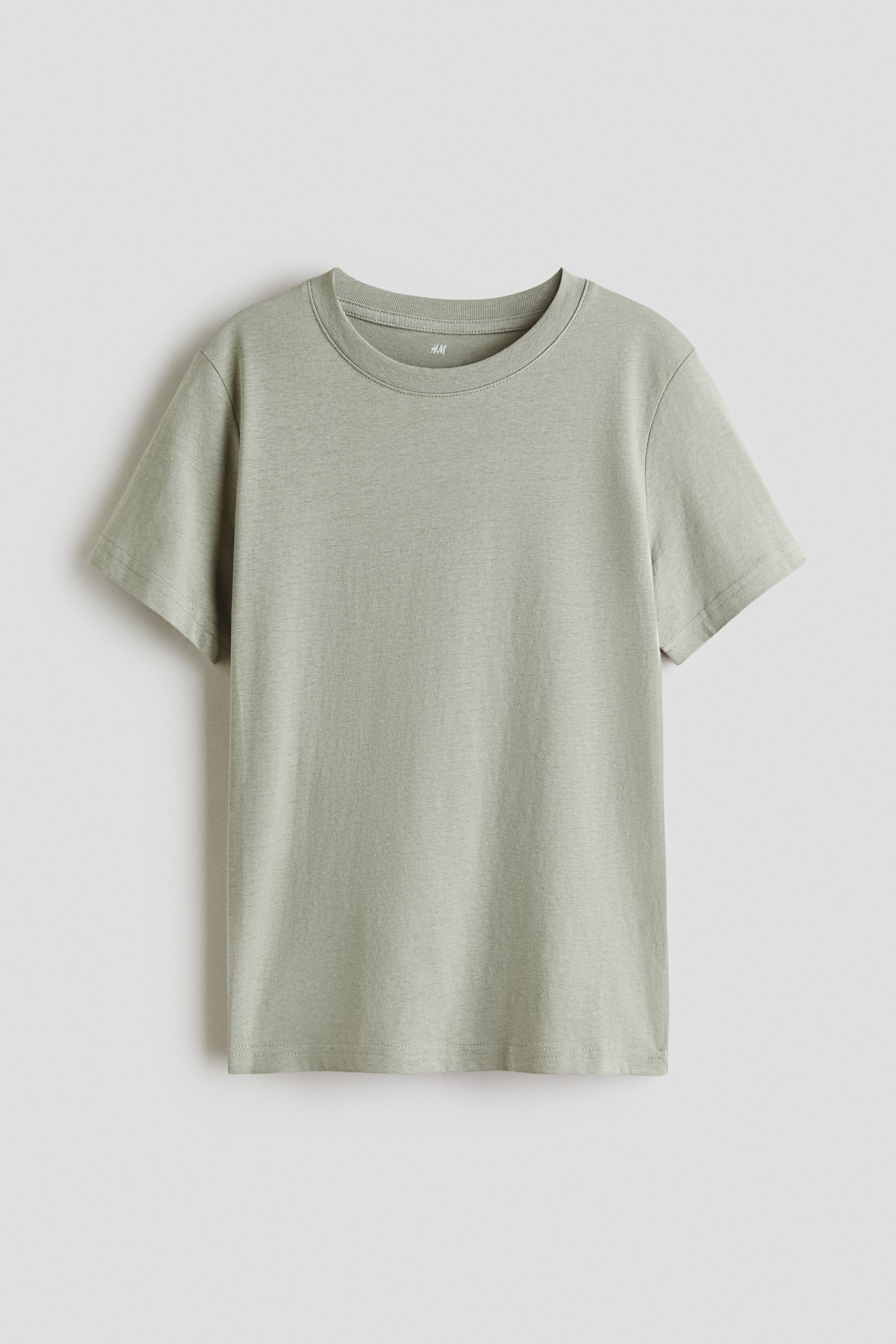 View larger image: A T-shirt in light green cotton jersey is lying flat, facing front, featuring short sleeves and a ribbed crew neck.
