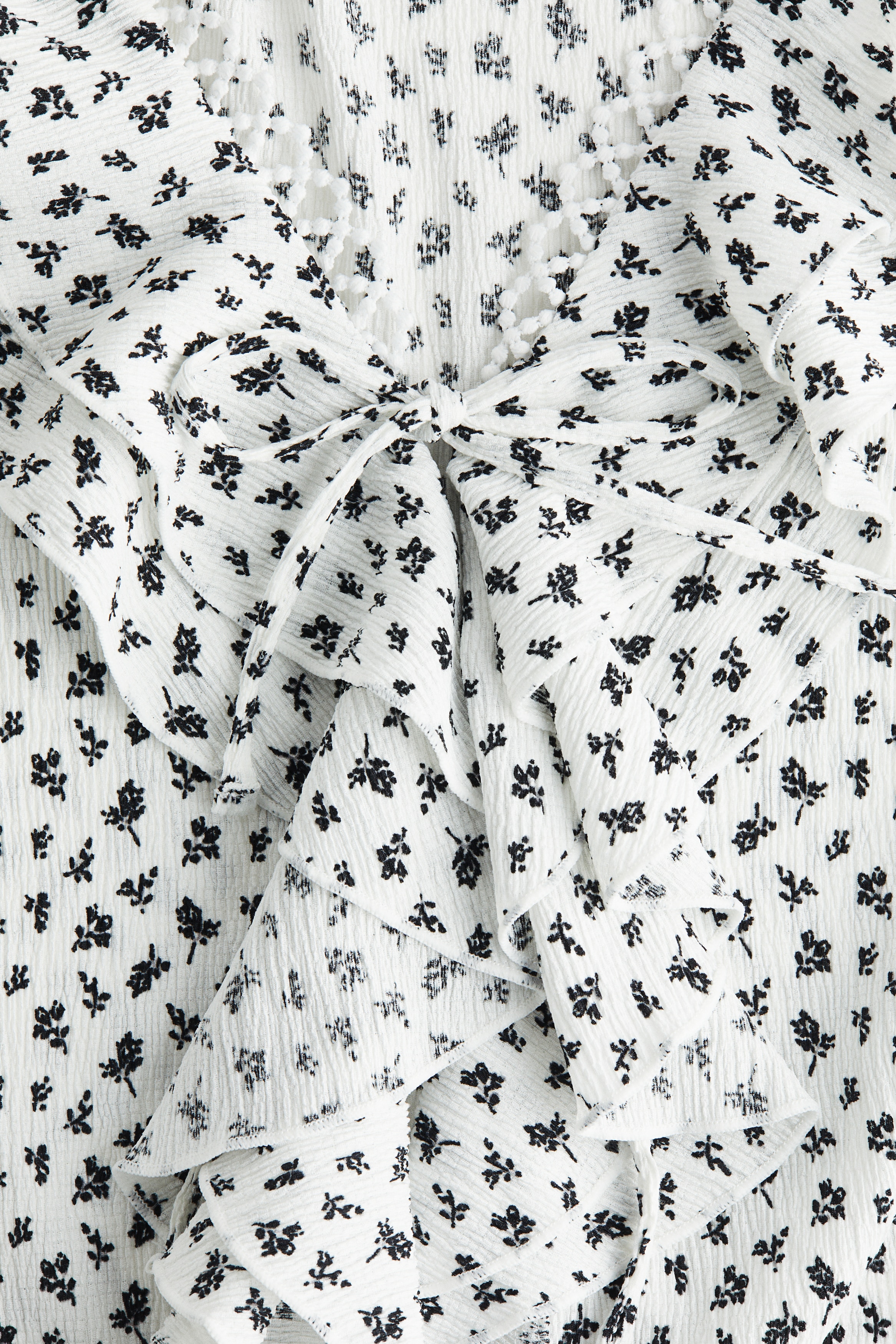 Flounce-trimmed blouse
