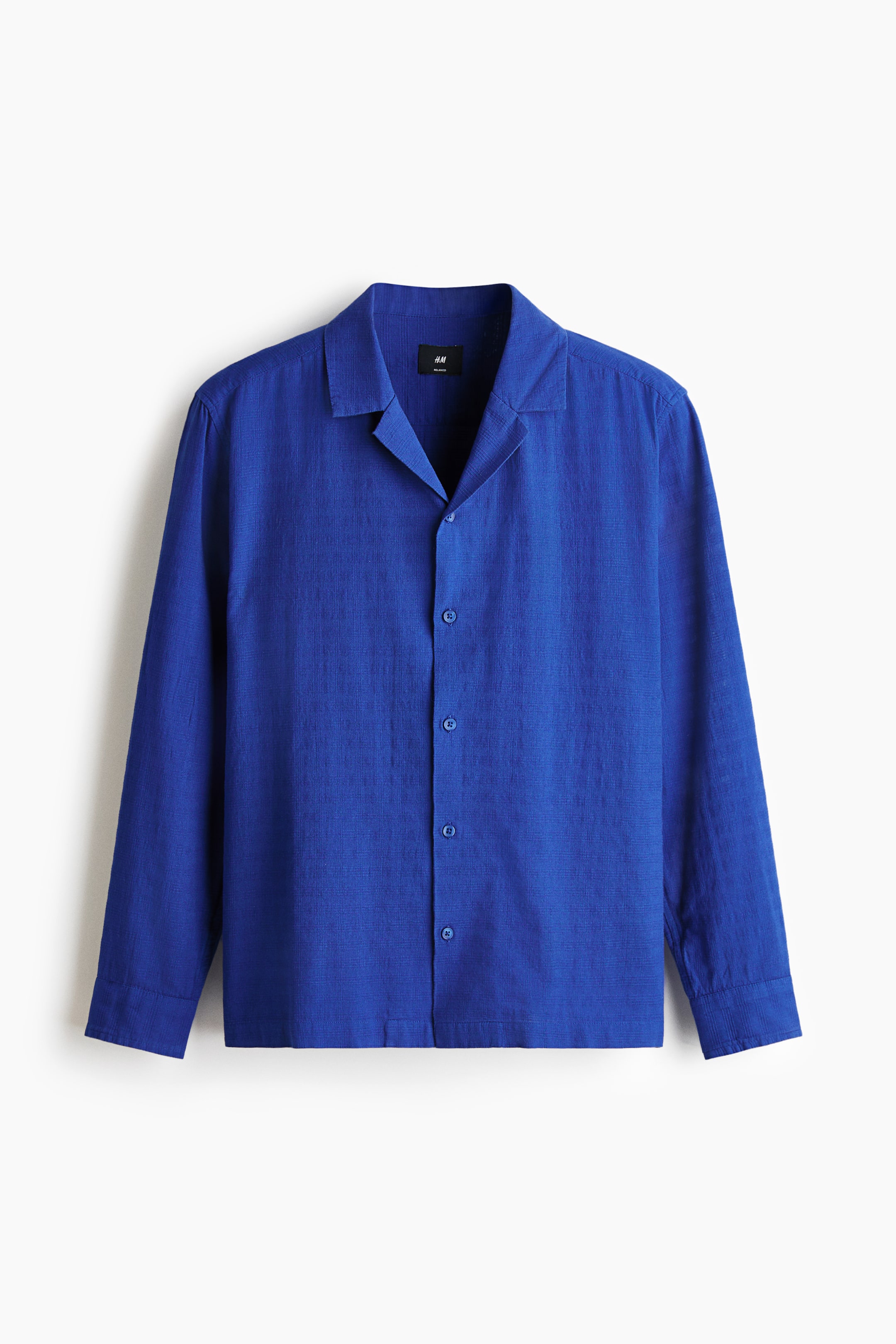 View larger image: A blue shirt is showcasing its FRONT, crafted from a textured cotton weave. It boasts a resort collar, a French front, long sleeves, and a straight-cut hem, providing a regular fit.