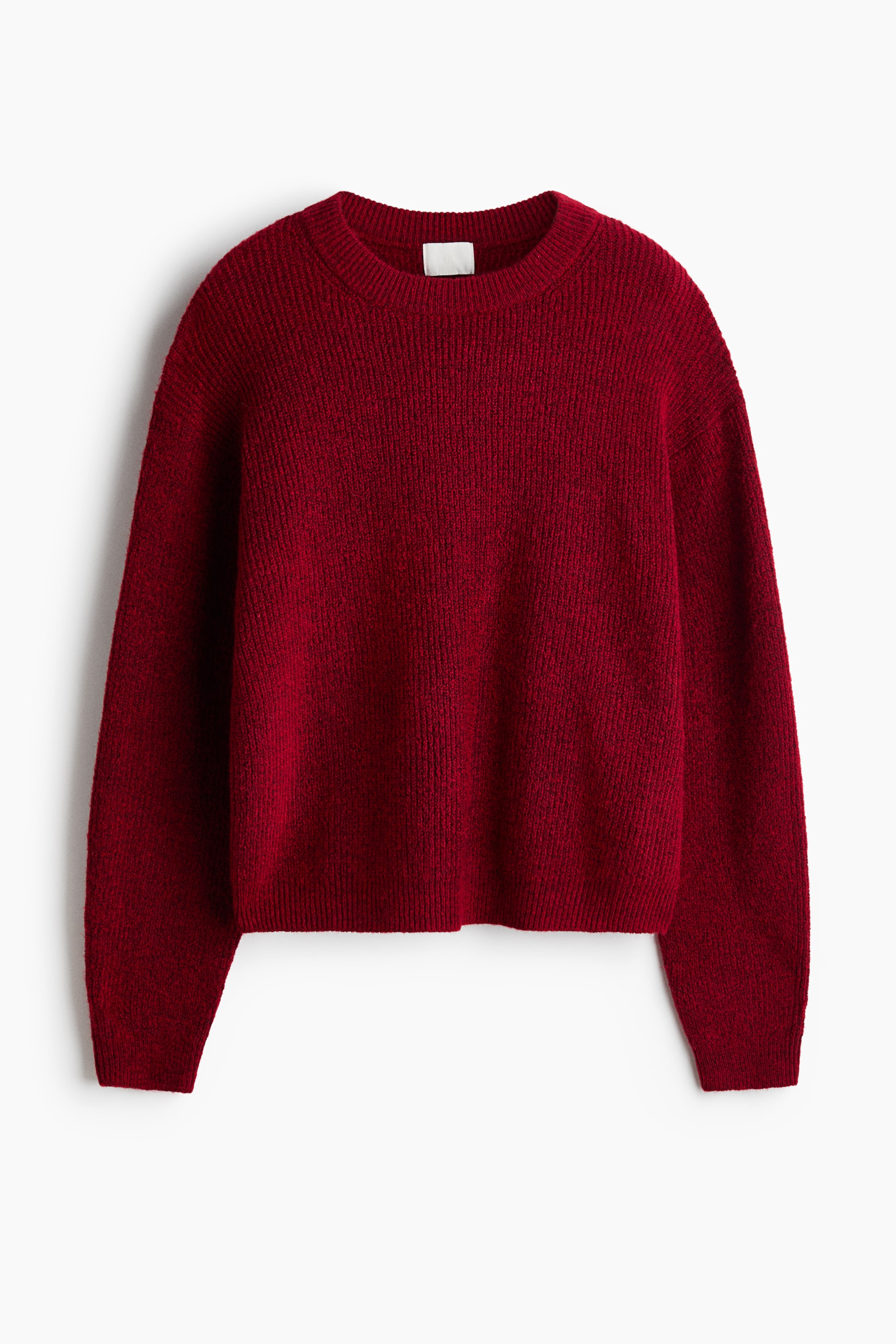 View larger image: A dark red knit sweater is shown from the front, featuring a ribbed crew neckline, dropped shoulders, and long sleeves. The sweater features a textured knit pattern with ribbed cuffs and a ribbed hem.