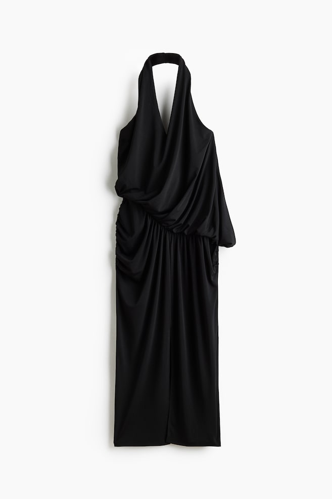 A black halter-neck dress is hanging facing front, presenting a deeply draped bodice with a plunging V-neckline. The dress is featuring a gathered, asymmetrical waist and a straight skirt with ruched detailing on the sides. - 1