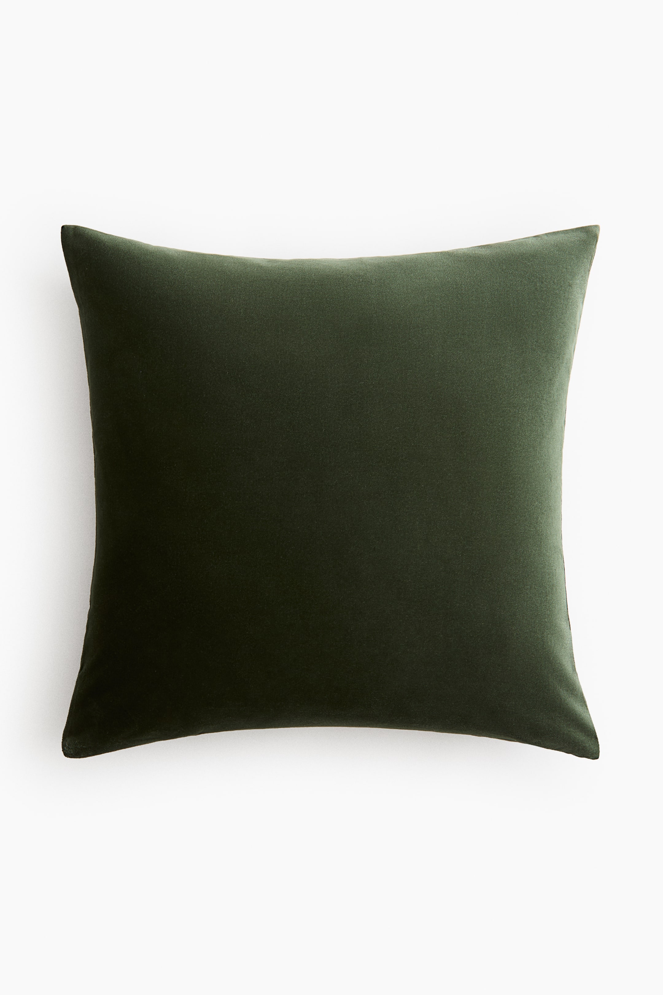 View larger image: A cotton velvet cushion cover is shown in a front-facing view, featuring a dark green plush surface and soft corners.