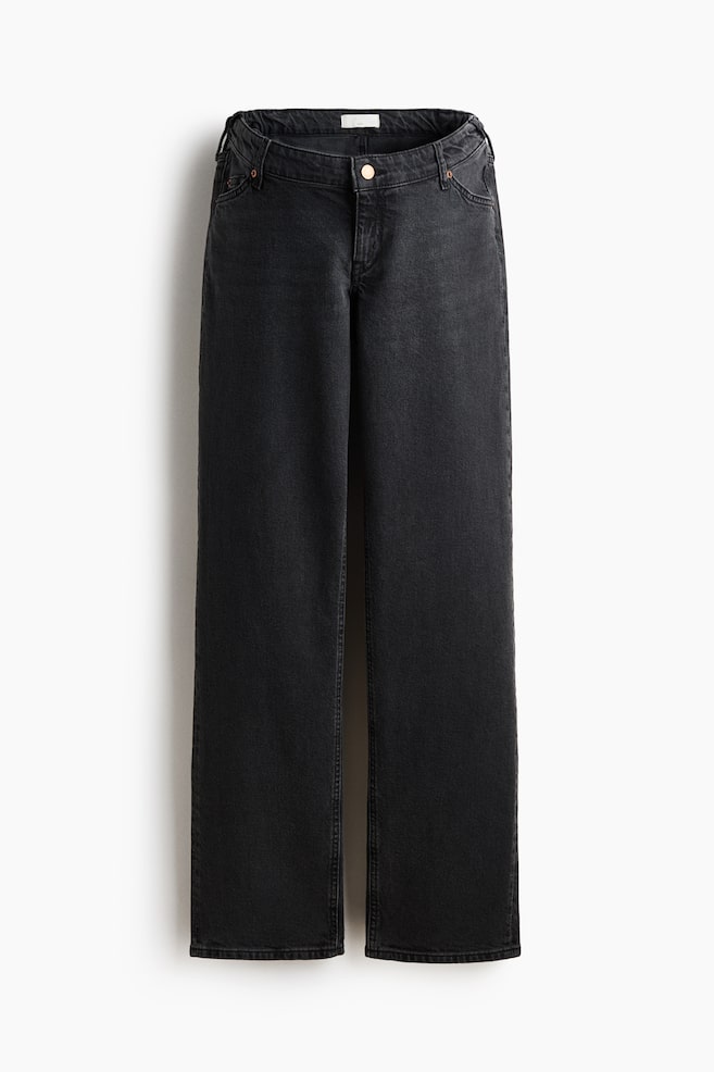 Black denim jeans are displaying a front view, featuring a high-rise waistband with belt loops, a copper-toned button, and a zipper fly. They are showing a straight-leg cut with front pockets and rivets. - 1