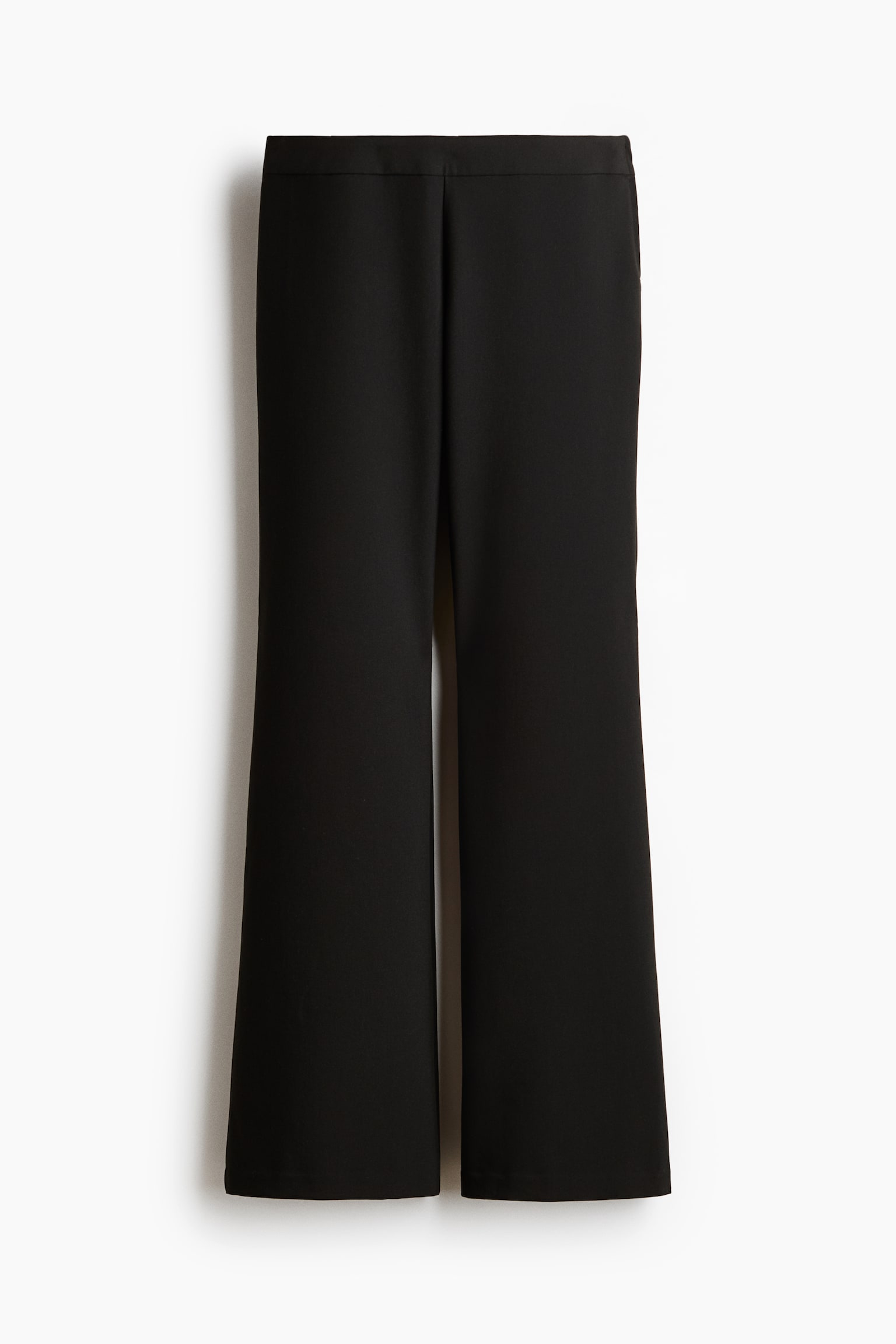 Black trousers are featuring a flat waistband and a wide-leg silhouette. The front is presenting a clean design with no visible pockets or closures, and the legs are flaring from the knee down. - 1