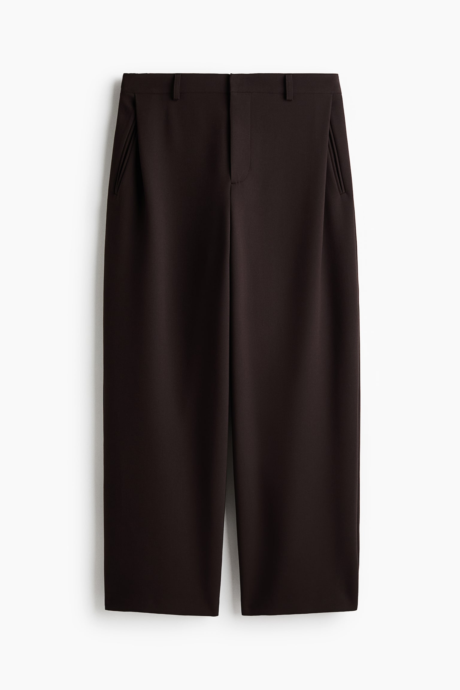 A pair of dark brown trousers is shown from the front, featuring a waistband with belt loops and a concealed front fastening. The design includes angled side pockets and subtle front pleats that flow into structured wide legs.