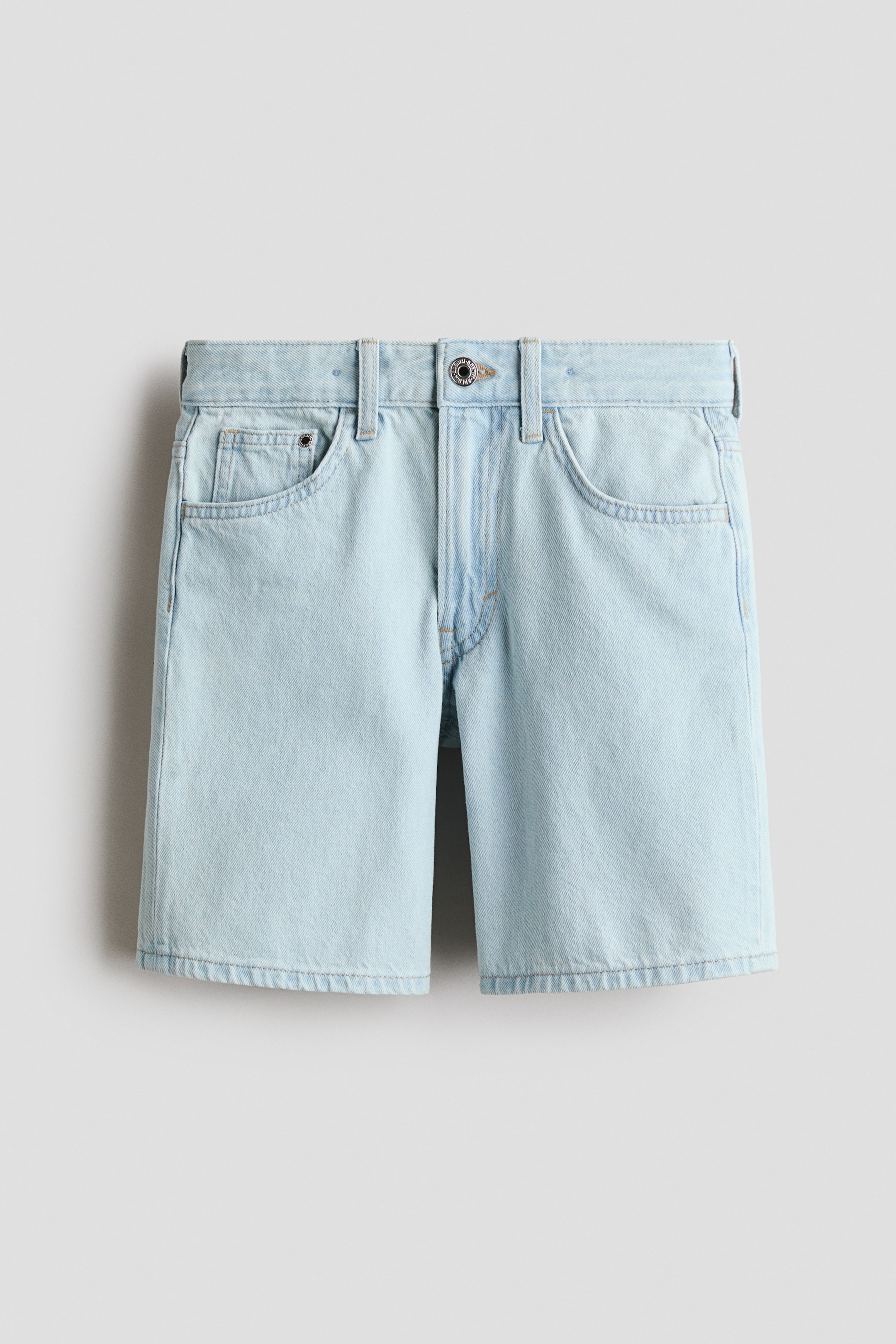 View larger image: The 5-pocket shorts in light blue soft denim are showcased from the front, featuring a relaxed fit through the hip and thigh. They highlight a waistband with belt loops, a button closure, a zip fly, and two front pockets with a coin pocket.