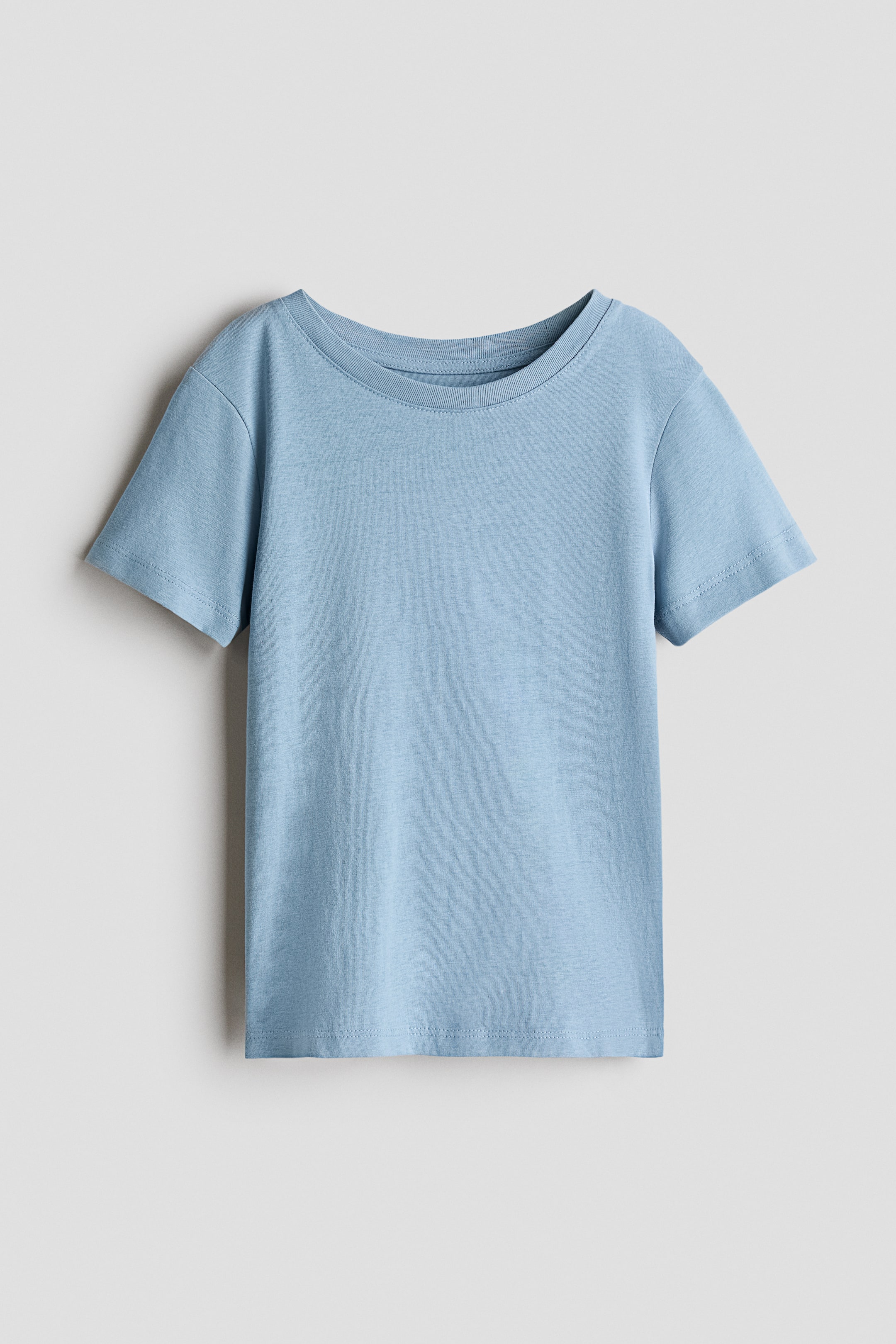 View larger image: A light blue T-shirt in soft cotton jersey is facing forward, showcasing a round, rib-trimmed neckline and short sleeves.