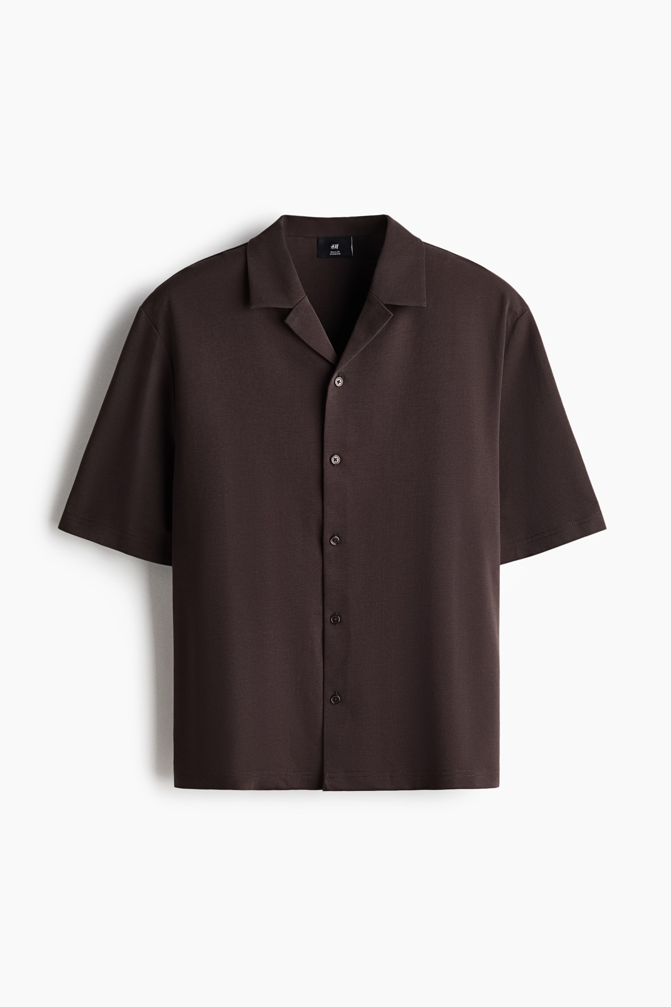 View larger image: A dark brown short-sleeve shirt is shown from the front, featuring a revere collar and a full button-front closure with dark buttons. It is designed with short sleeves and a straight hem.