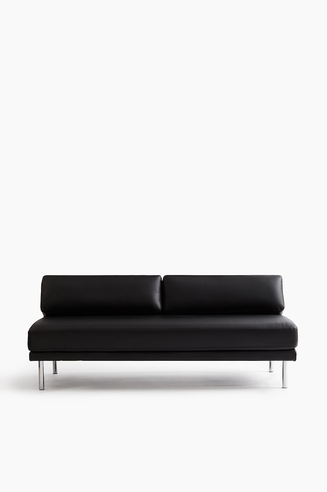 Un canapÃ© en cuir noir sans accoudoirs est prÃ©sentÃ© de face, avec un seul coussin dâassise continu et deux coussins de dossier rectangulaires. Cette piÃ¨ce minimaliste repose sur quatre fins pieds mÃ©talliques cylindriques. - 1