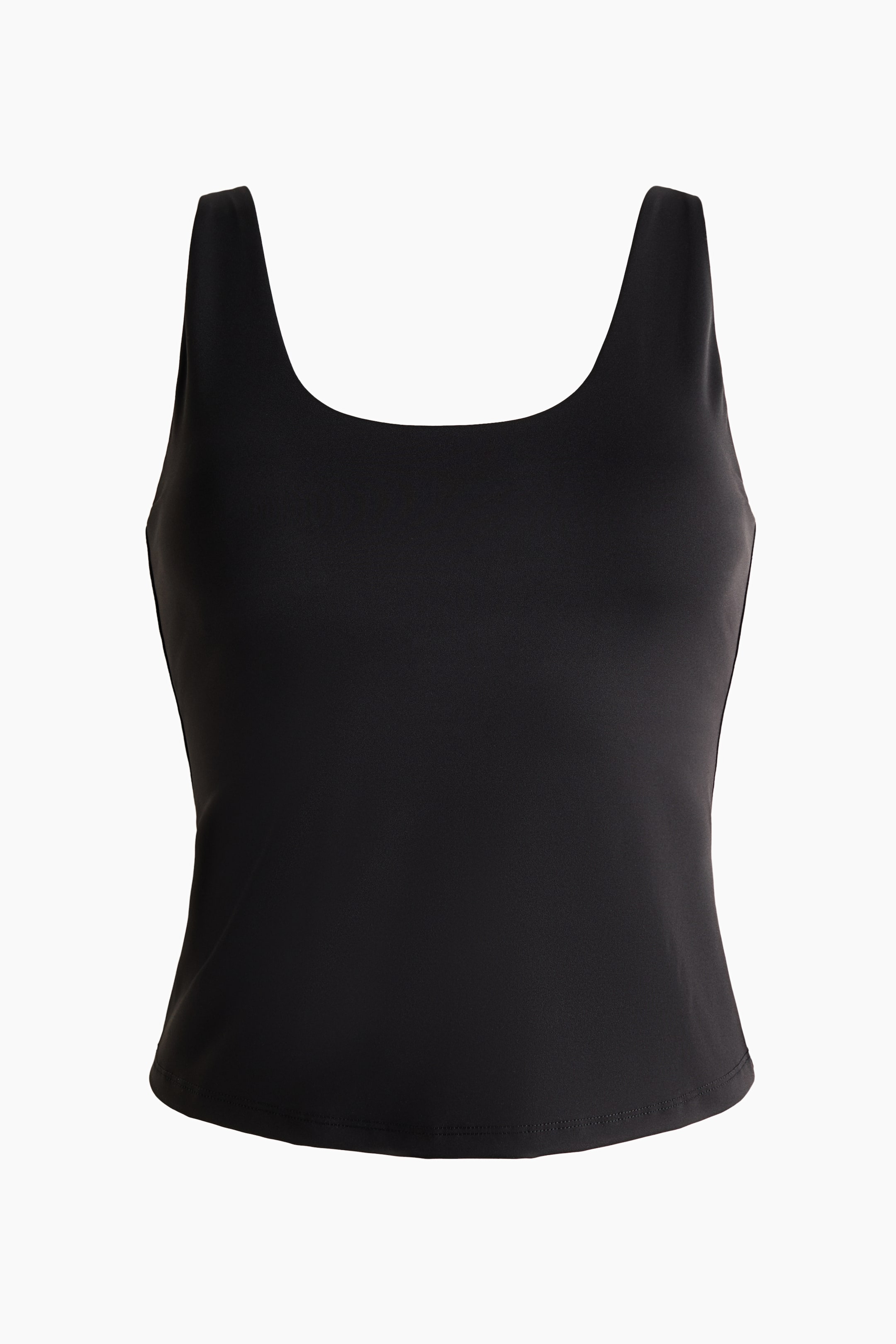 View larger image: A black tank top is showcased from the front, slightly angled to the right, featuring a scoop neckline, wide shoulder straps, and a straight hem. It is crafted from a smooth fabric.