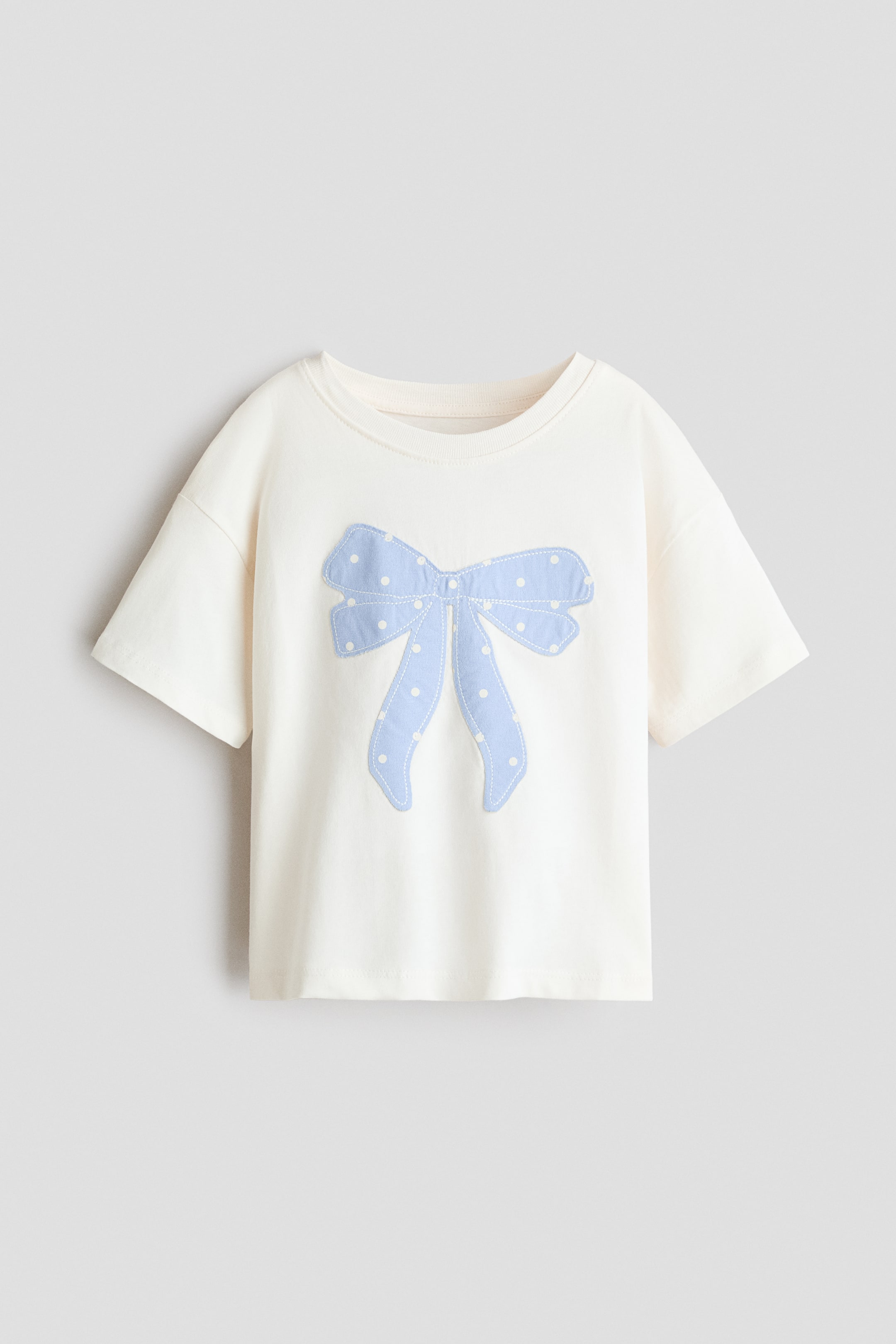 Voir une image plus grande: T-shirt en coton avec appliqués - Crème/boucle - Kids | H&M CA 1