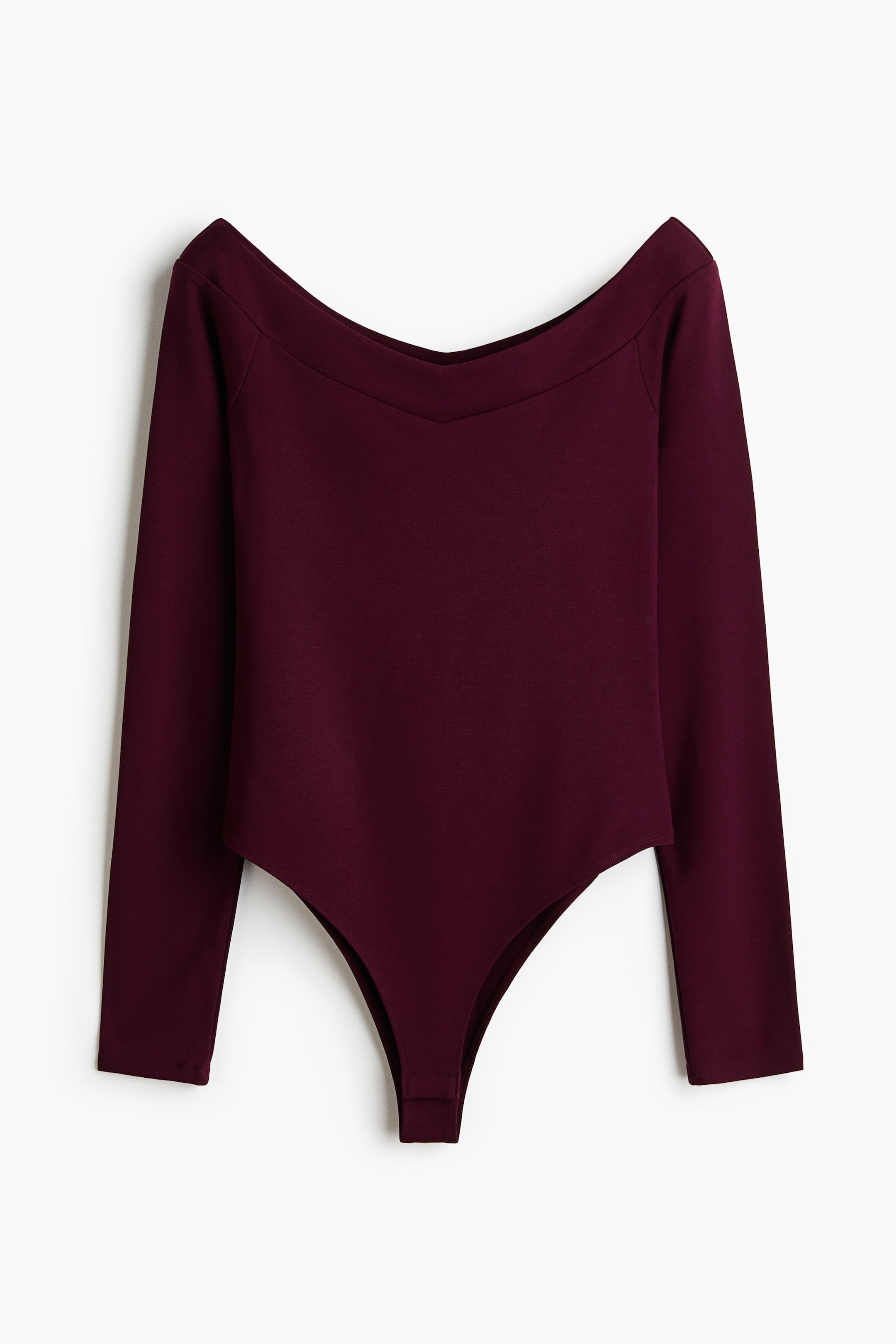 View larger image: A burgundy long-sleeved bodysuit is showcased from the front, highlighting an off-the-shoulder V-neckline and a thong-style bottom.