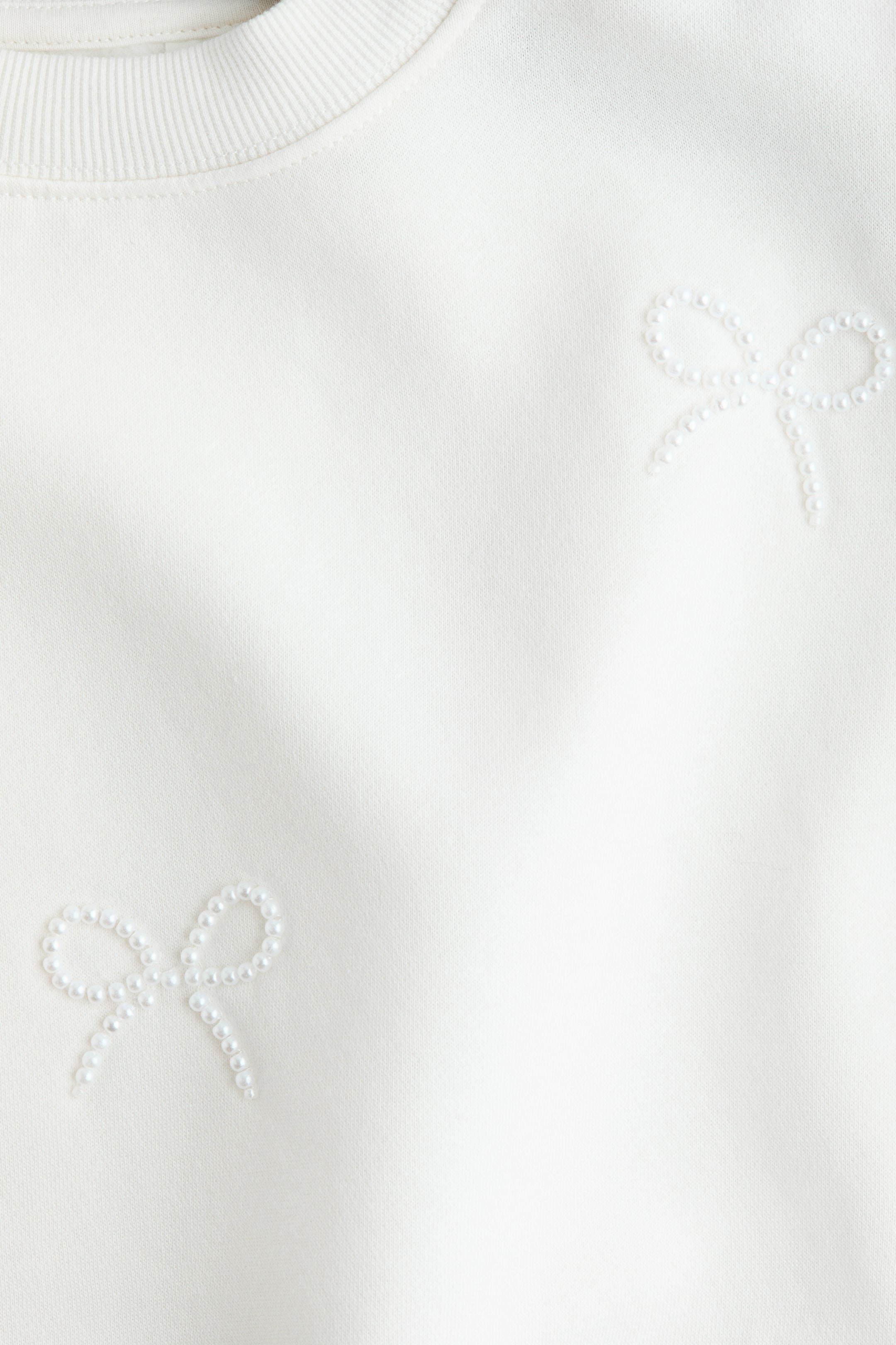 View larger image: Motif-detail sweatshirt - White/Bows - Kids | H&M 2