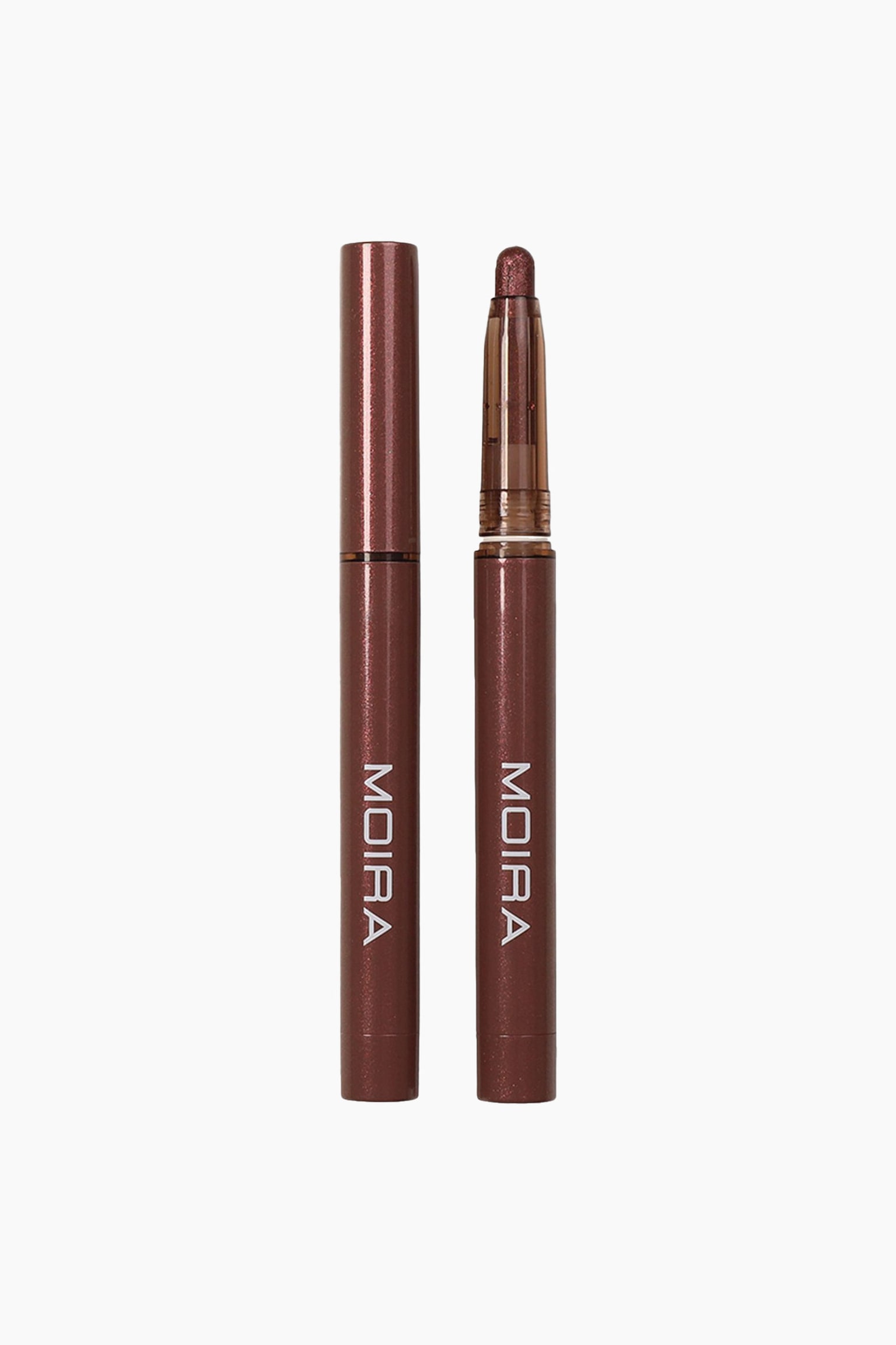 Stellar Glaze Stick Shadow stÃ¥r lodret i to versioner: en med hÃ¦tte til venstre og en uden hÃ¦tte til hÃ¸jre, begge med metalliske bronze-brune hylstre og et hvidt, lodret logo. Pennen uden hÃ¦tte til hÃ¸jre viser en afrundet, skinnende bronze Ã¸jenskyggetip, der stikker frem fra en gennemsigtig, tonet plastikholder.