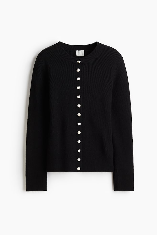 A black cardigan is presented front-facing, featuring a round neck and long sleeves. It has a ribbed knit texture and an eleven-button placket of silver-toned, round buttons running down the front. - 1