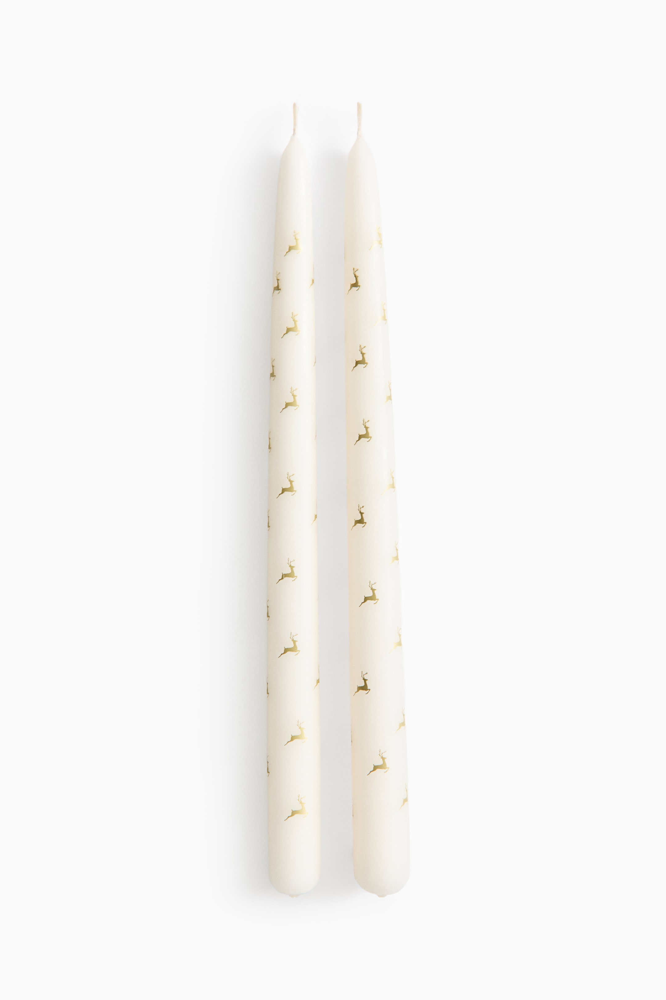 Grotere afbeelding bekijken: Set van 2 conische kaarsen met dessin - Roomwit/rendieren - HOME | H&M NL 1