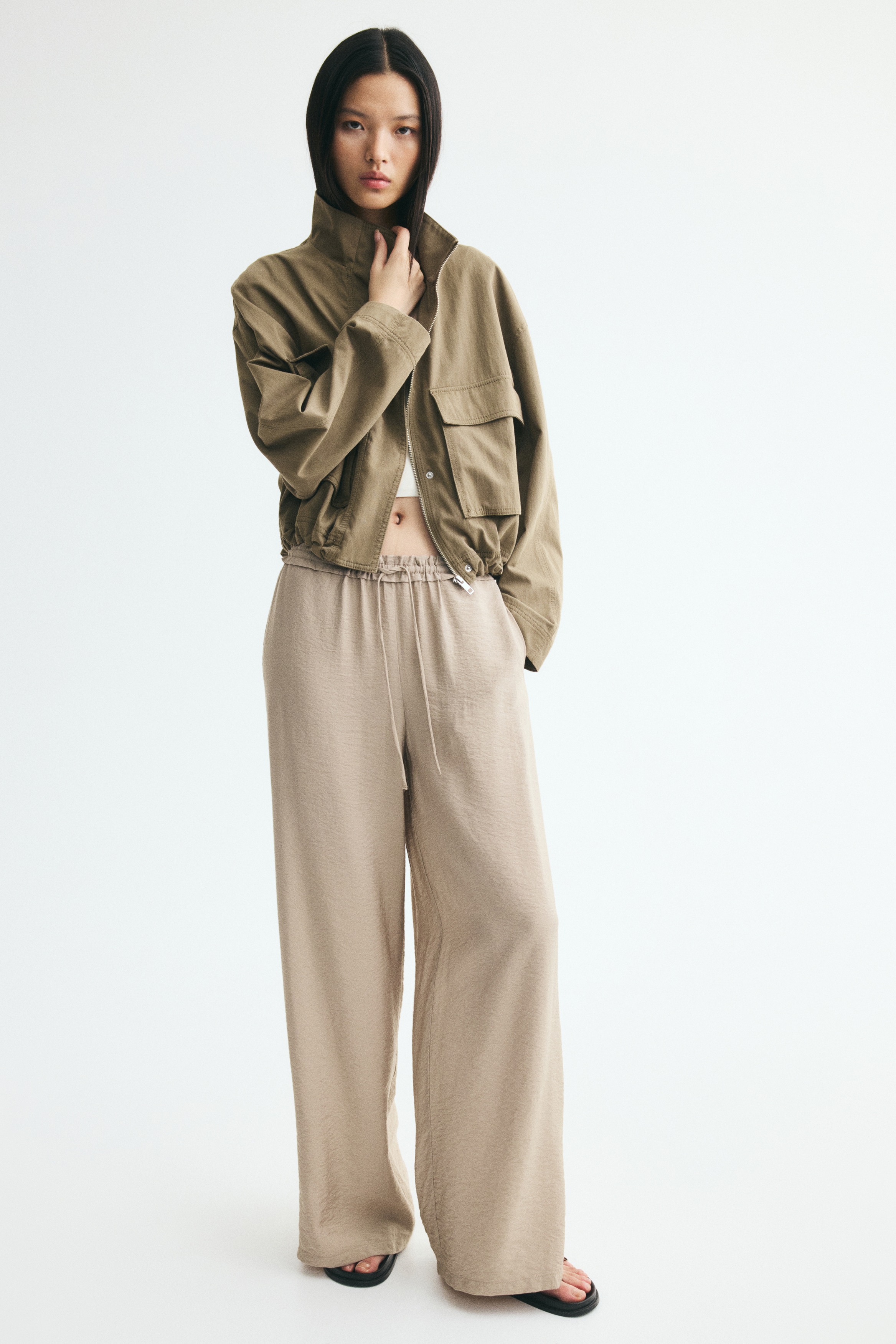 Viscose-blend drawstring trousers - Beige/Schwarz