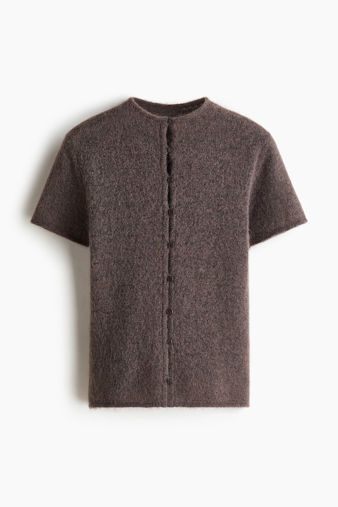 A dark brown, fuzzy knit short-sleeve cardigan is presenting its front view. It is featuring a round neckline and a full button-front closure with several small dark buttons running down the center. - 1