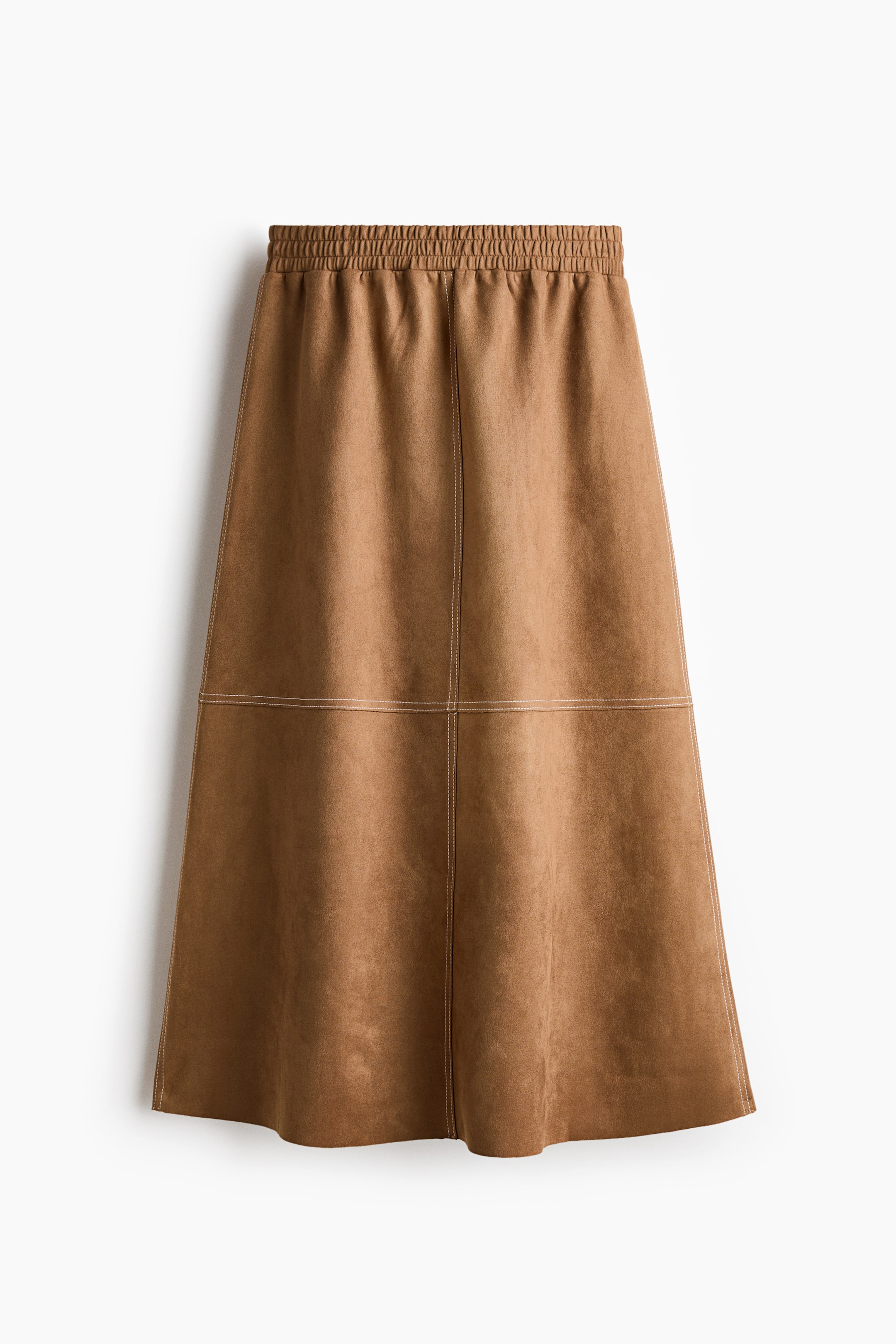 View larger image: A tan-colored midi skirt is presenting with an elasticated, shirred waistband and prominent white topstitching detailing vertical and horizontal panel lines on its front. It features a suede-like texture and an A-line silhouette.