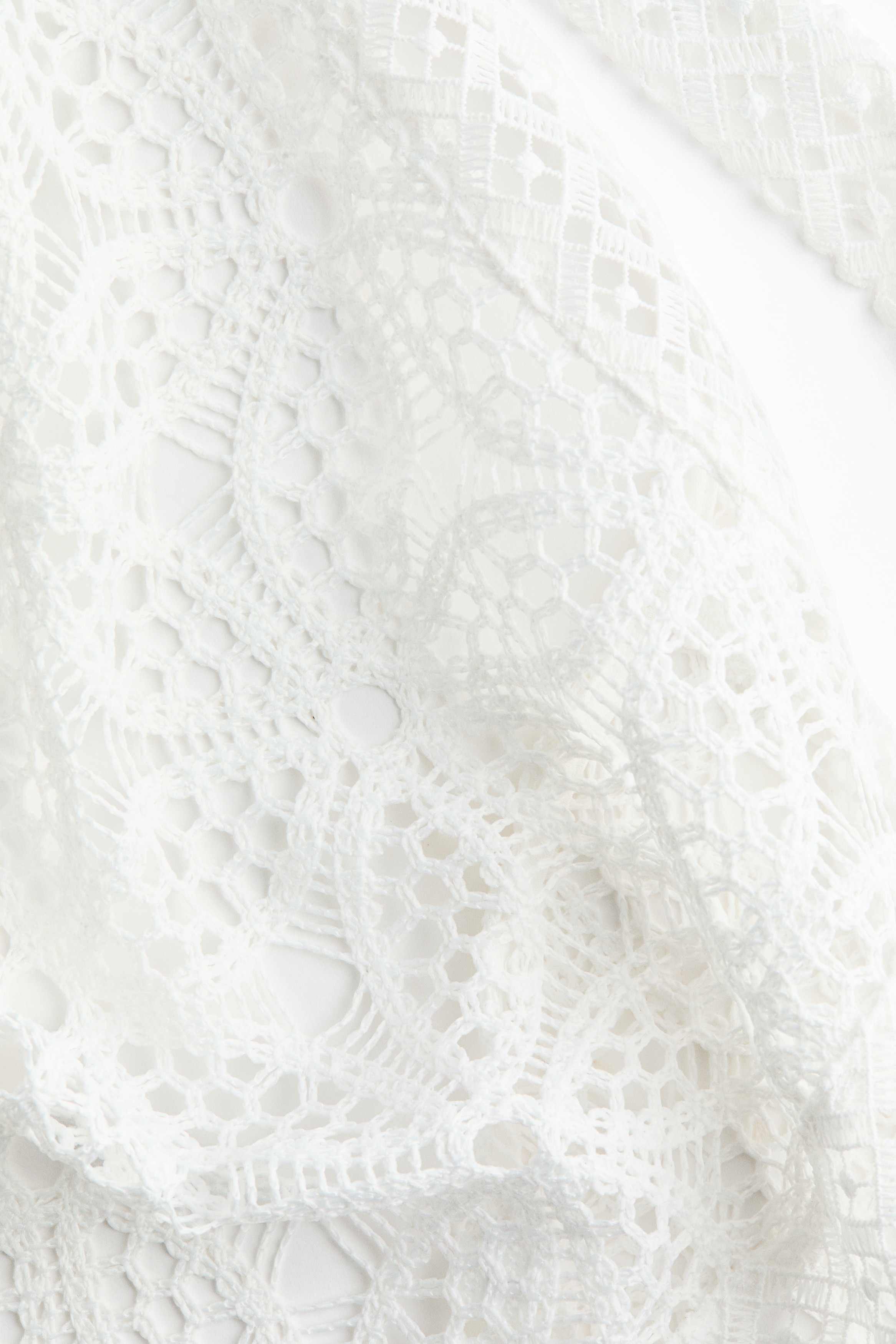 Asymmetric lace halterneck top