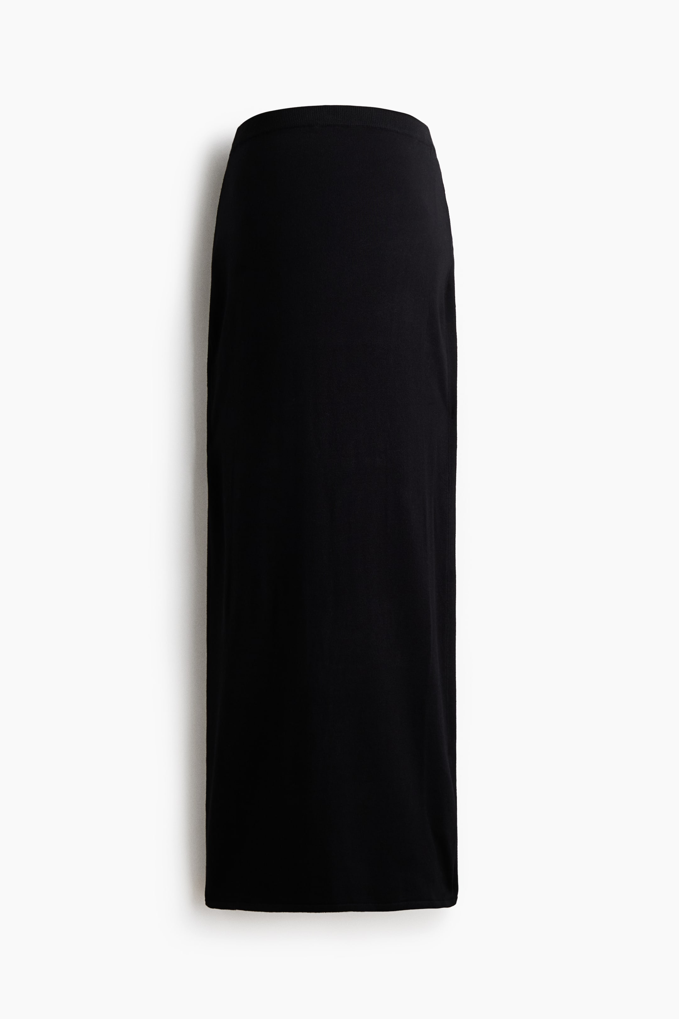 View larger image: A black straight-cut skirt is shown from the front, featuring a ribbed waistband and a smooth fabric texture.