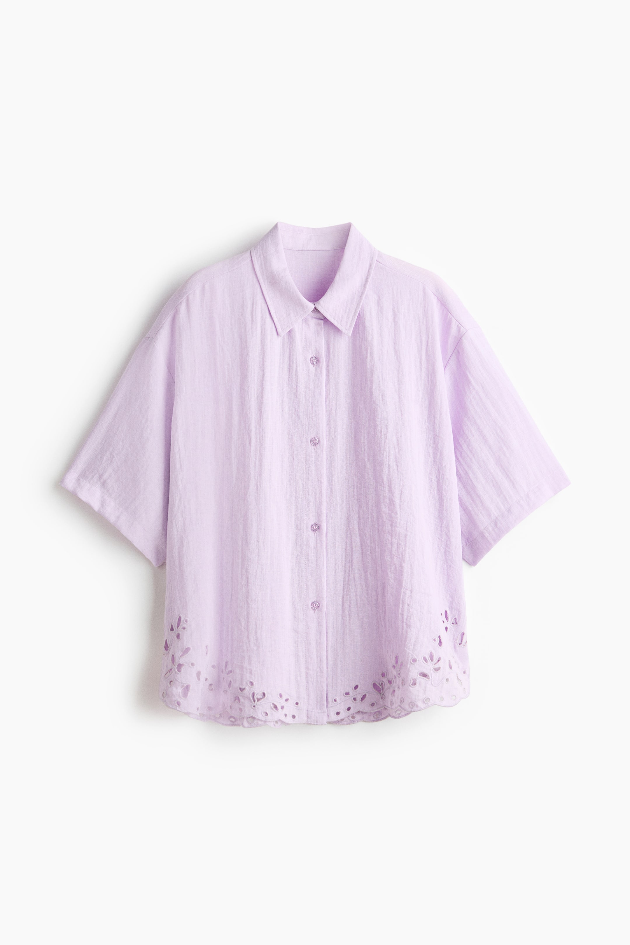 View larger image: This light purple, loose-fit beach shirt in woven fabric showcases a front with a collar, button-down front, dropped shoulders, and elbow-length sleeves. The curved hem is elegantly adorned with broderie anglaise.